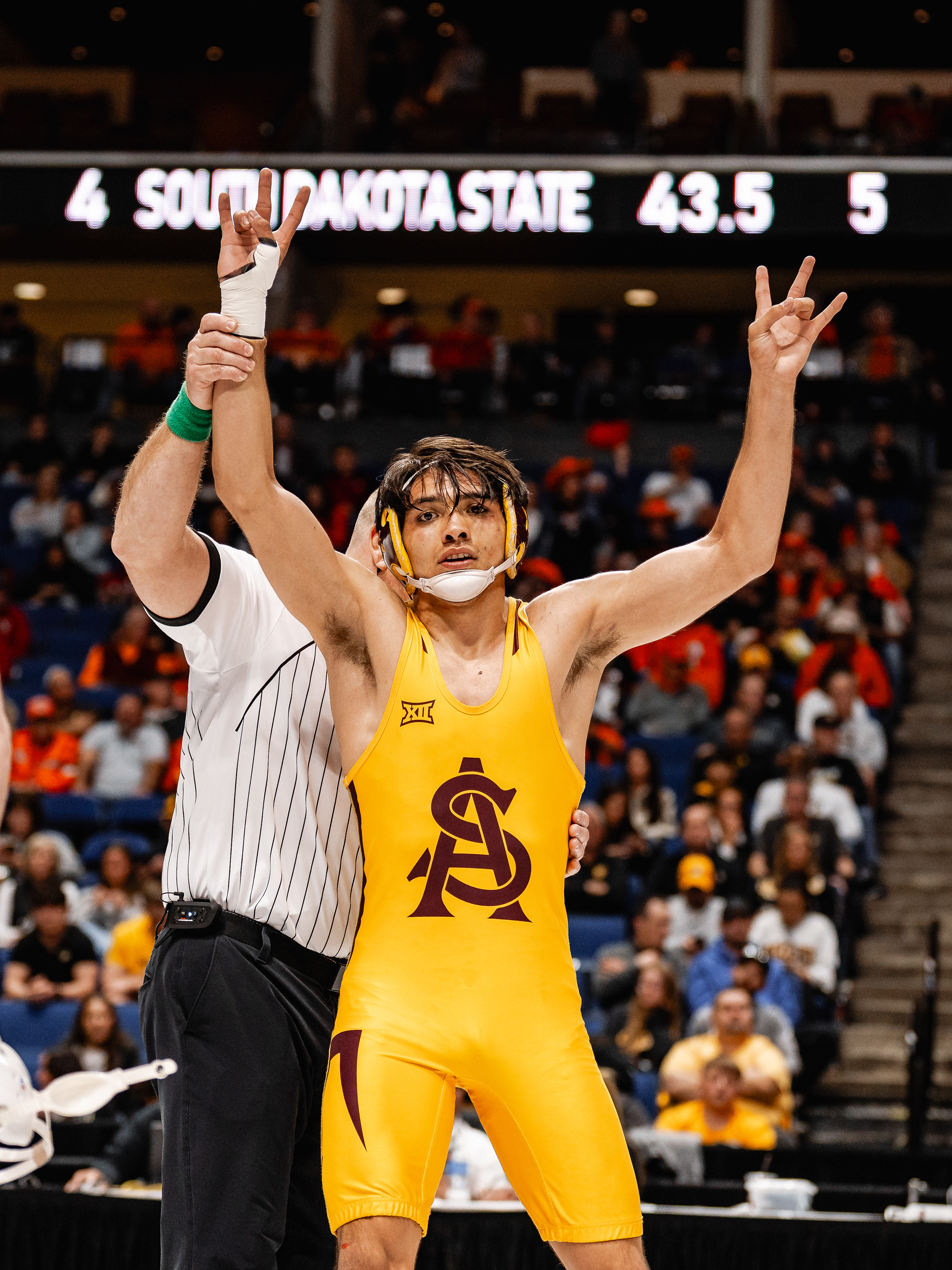 Nicco Ruiz, Arizona State University wrestler, gives the “forks up” sign after winning a match during the Big 12 Championships at the BOK Center on Friday, March 6, 2026 in Tulsa, Oklahoma. 
