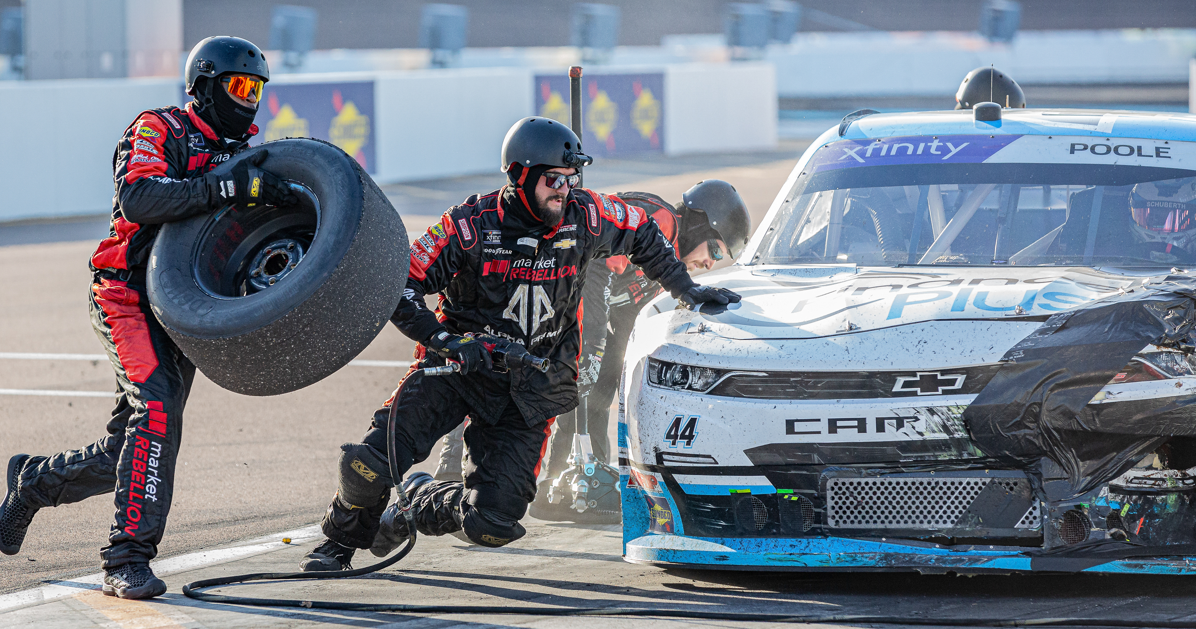 Brennan Pooles pit crew does a tire change on his car during a pit stop at Phoenix Raceway on Saturday, March 9, 2024 in Avondale, Arizona.