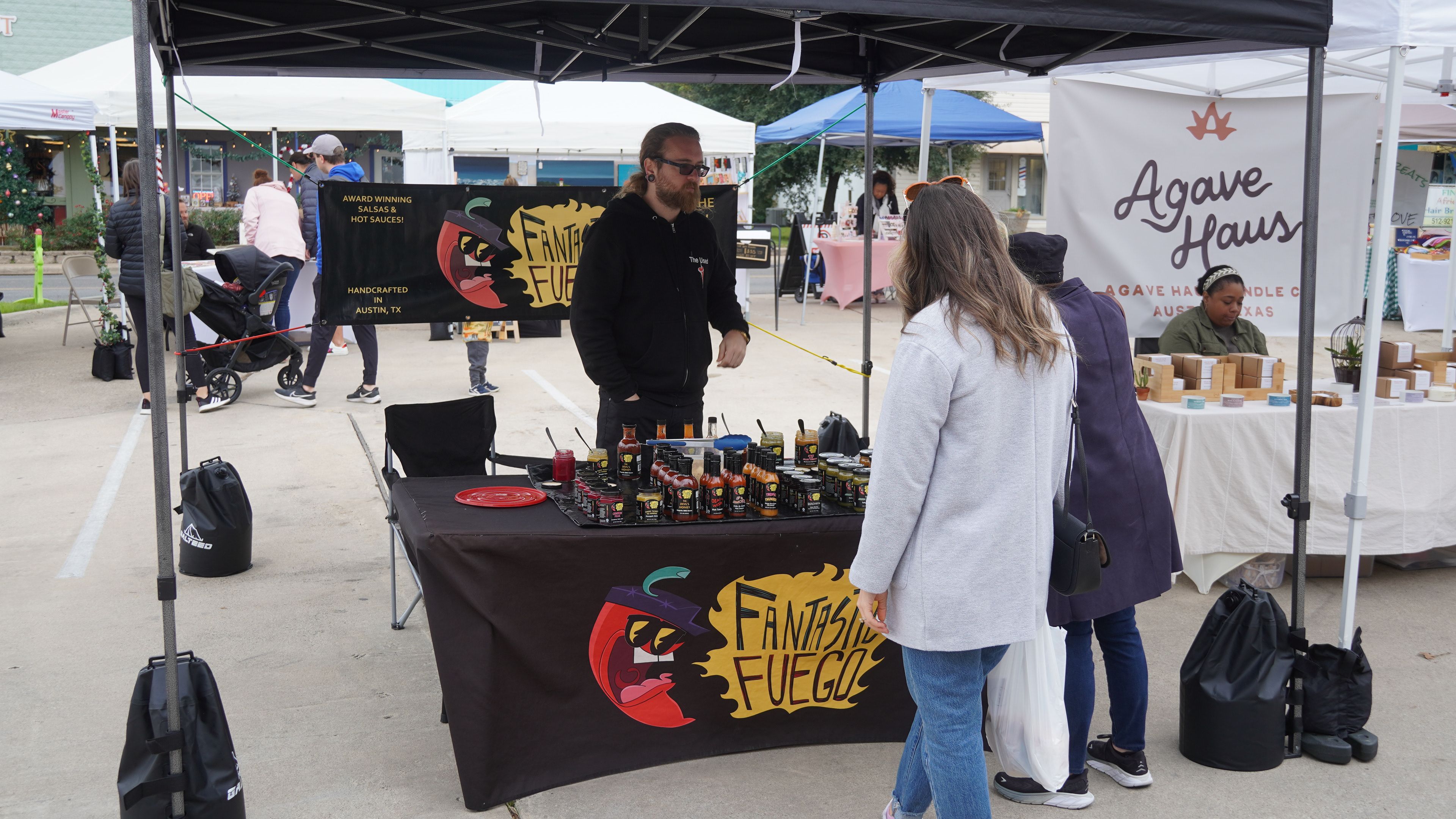 Selling hot sauce locally as a vendor.