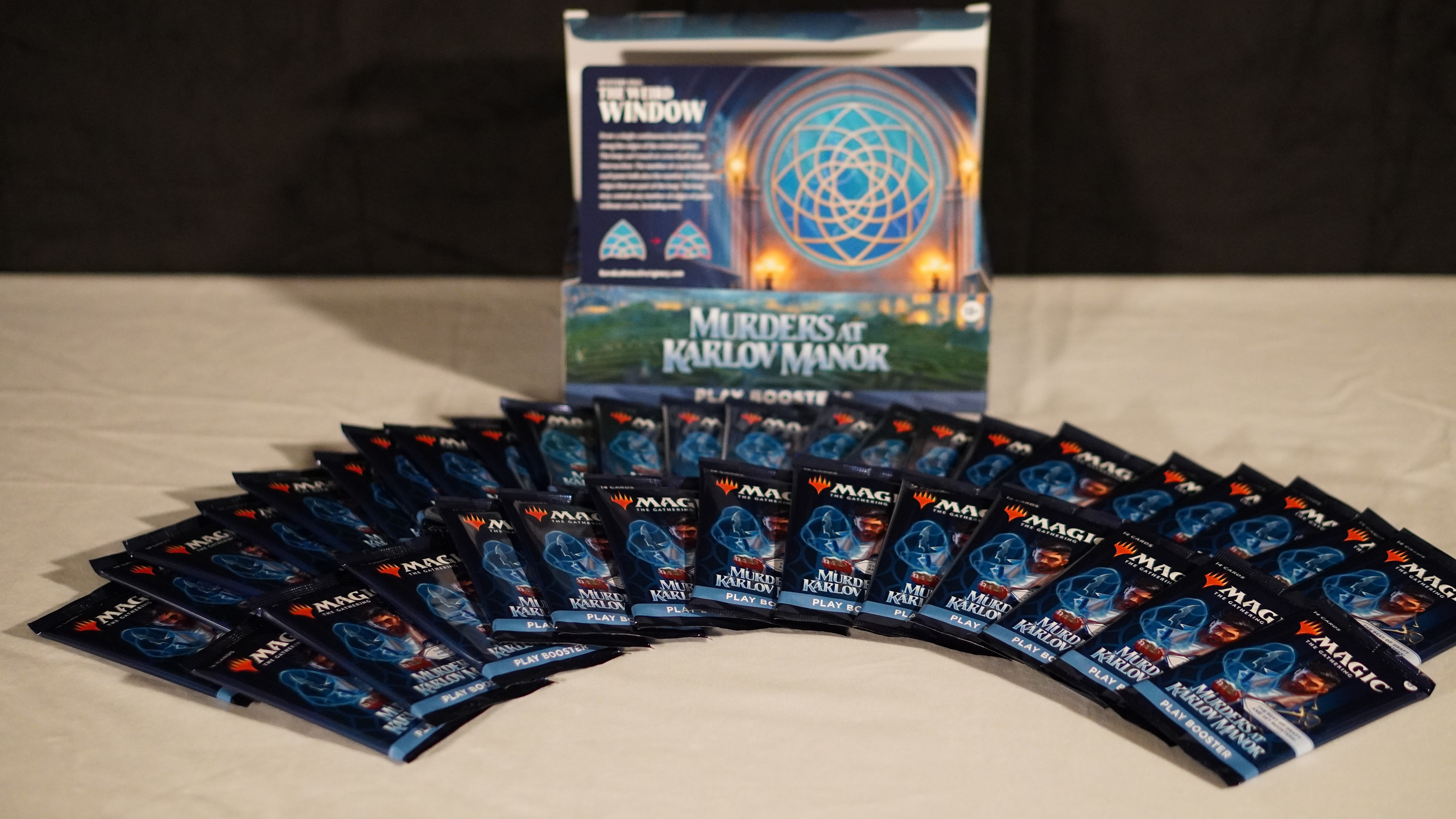 Showing what comes in a box of magic the gathering.