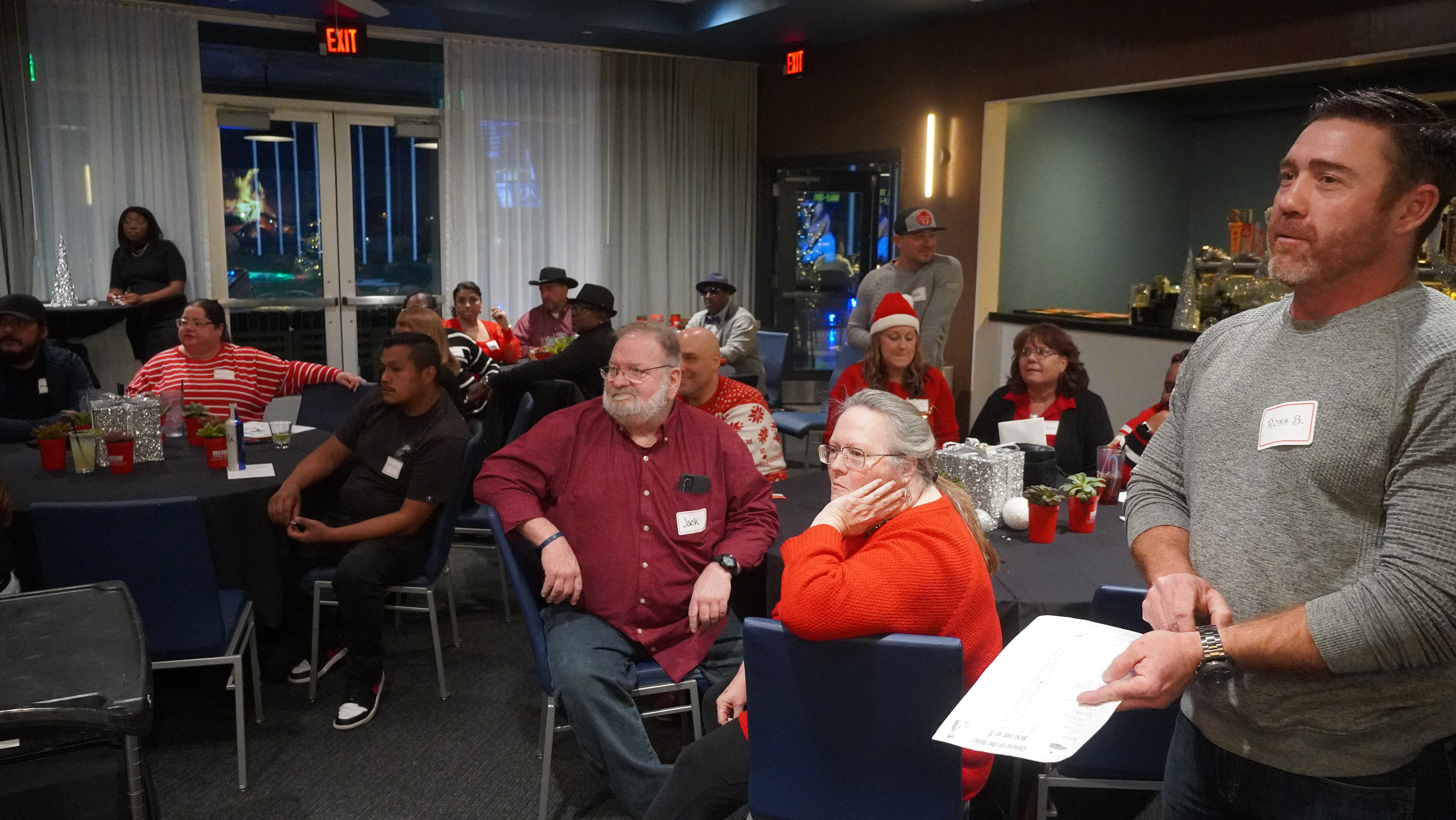 Listening to a speech at the Christmas party.