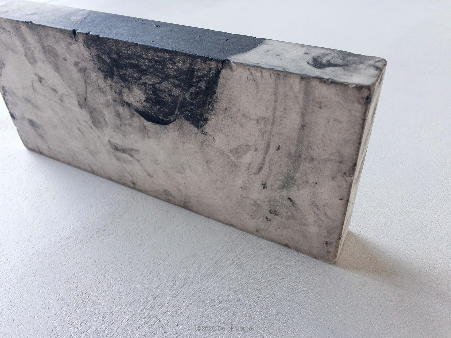 2020062201, 2020 Graphite, engineered marble, and varnish 9.5" x 4" x 1.25" (24.13cm x 10.16cm x 3.175cm) by Derek Lerner