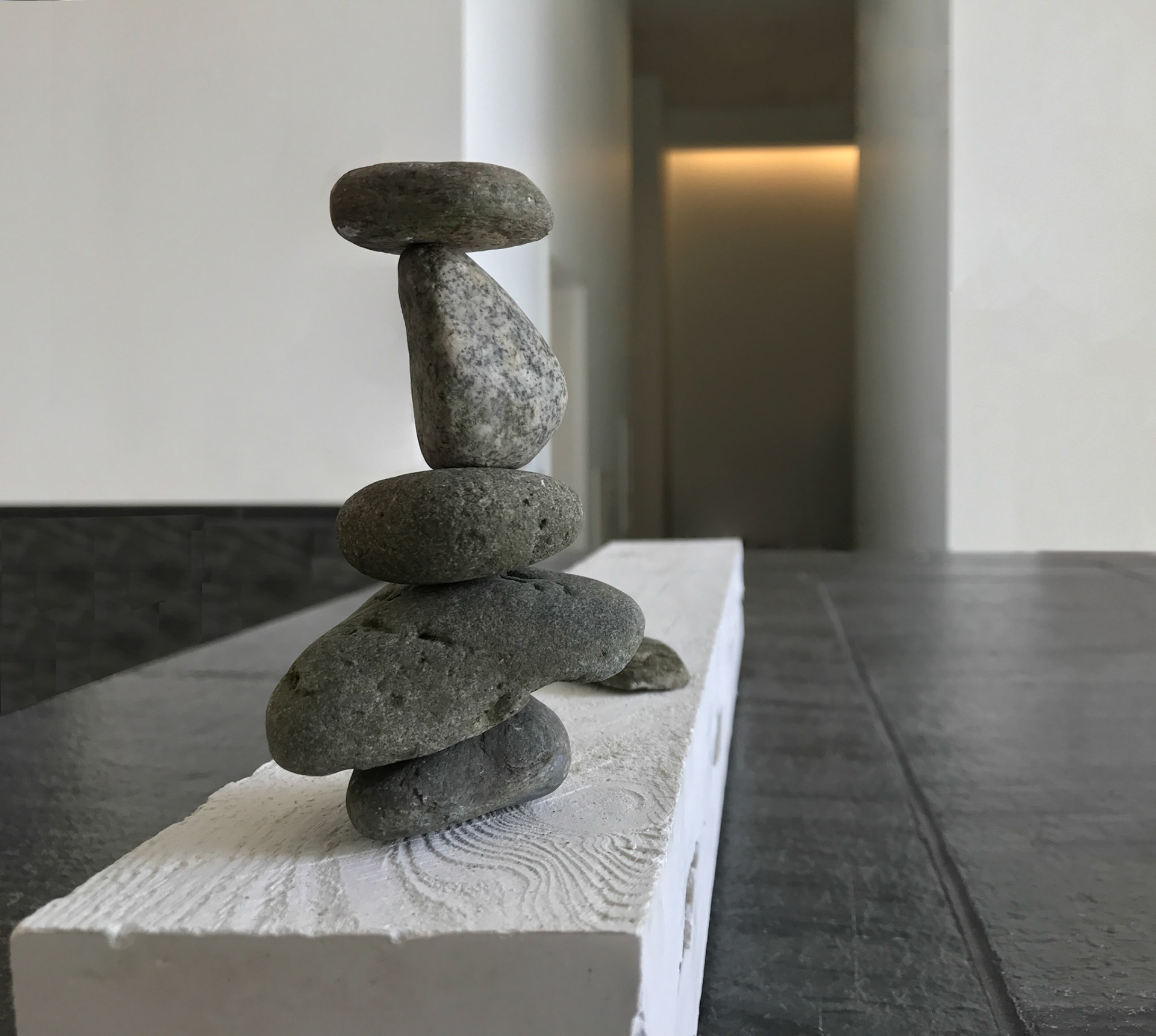 Balance, 3x25x6 Inches, Plaster Cast of Reclaimed Pallet Wood, Stones, Instillation Shot (Detail), 2019 