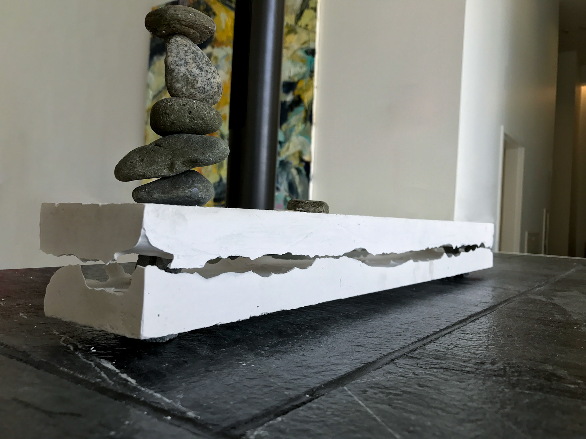 Balance, 3x25x6 Inches, Plaster Cast of Reclaimed Pallet Wood, Stones, Instillation Shot (Detail), 2019 