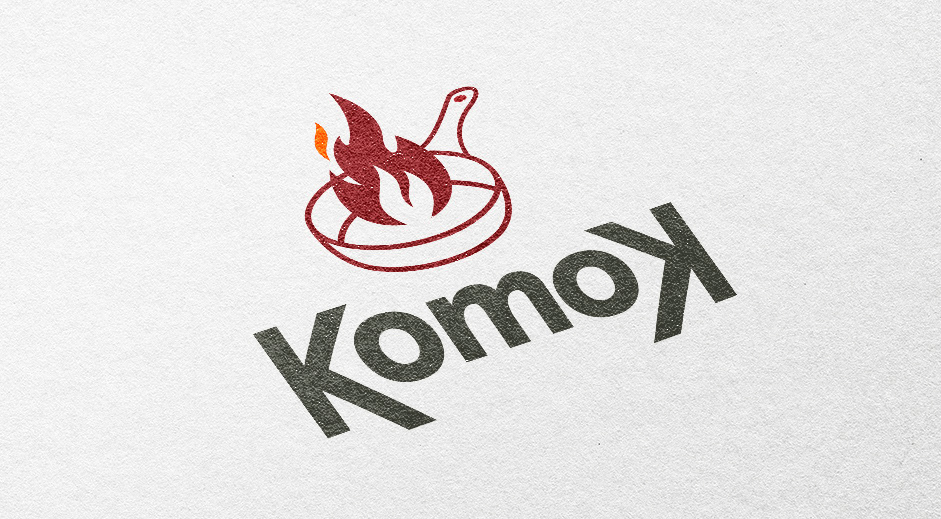 Komok logotipo