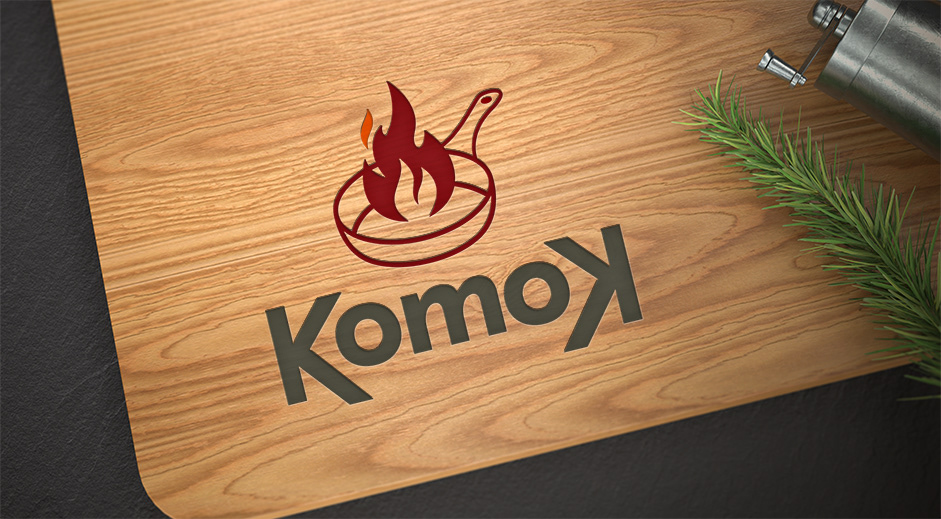 Komok logotipo