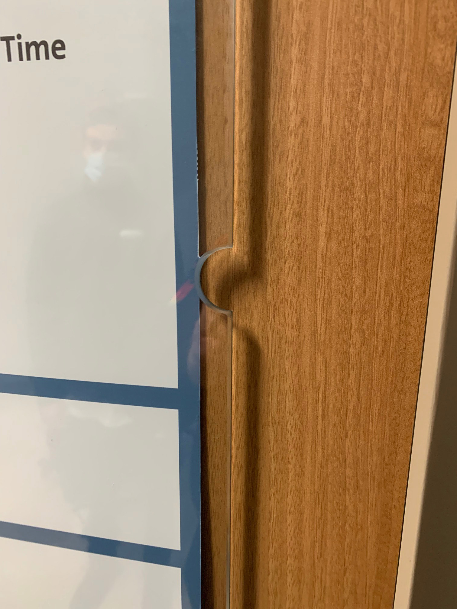 Glass Marker Board (close-up of thumb notch -- insert can be flipped around to display Spanish translation on reverse), Patient Room • Duke University Hospital • Durham, NC