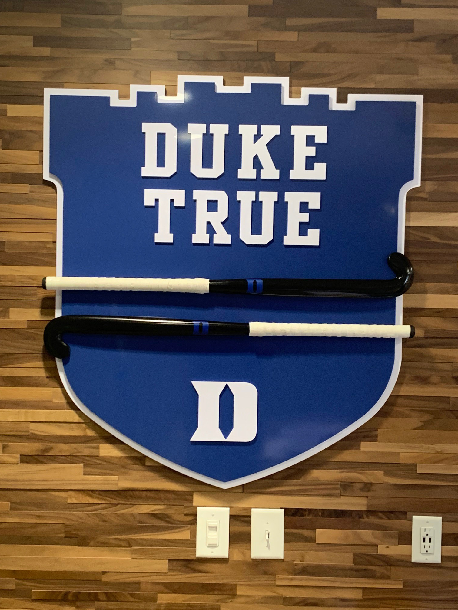 Duke Field Hockey • "DUKE TRUE" dimensional wall shield display (holds field hockey sticks, closeup)