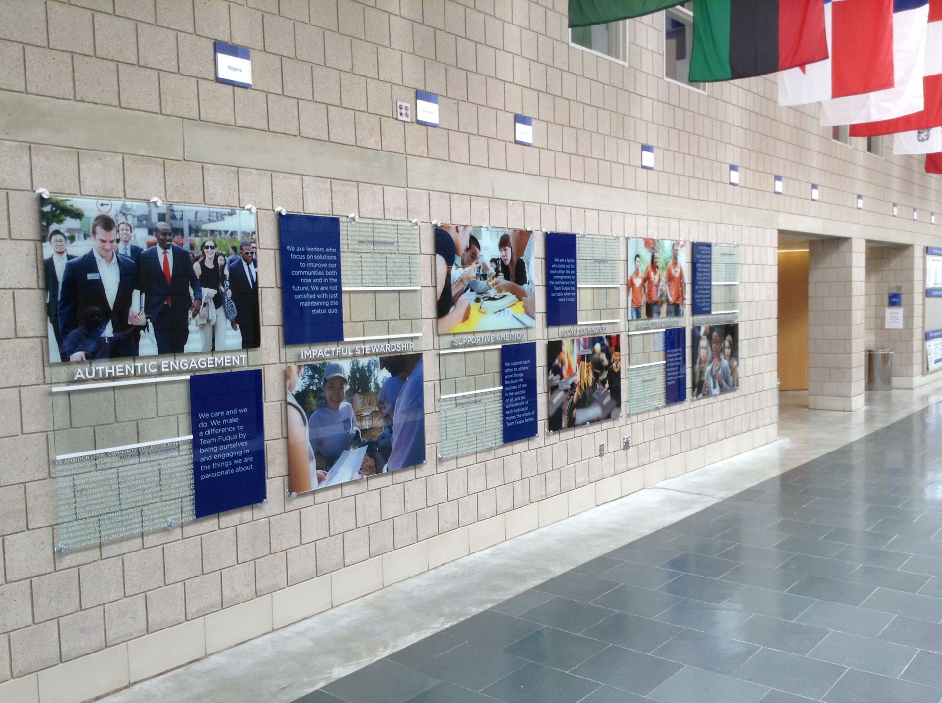 Team Fuqua Display Wall (glass panels w/ digital prints on clear, 2nd surface, plus stainless steel dimensional core values)• Duke University's The Fuqua School of Business • Durham, NC