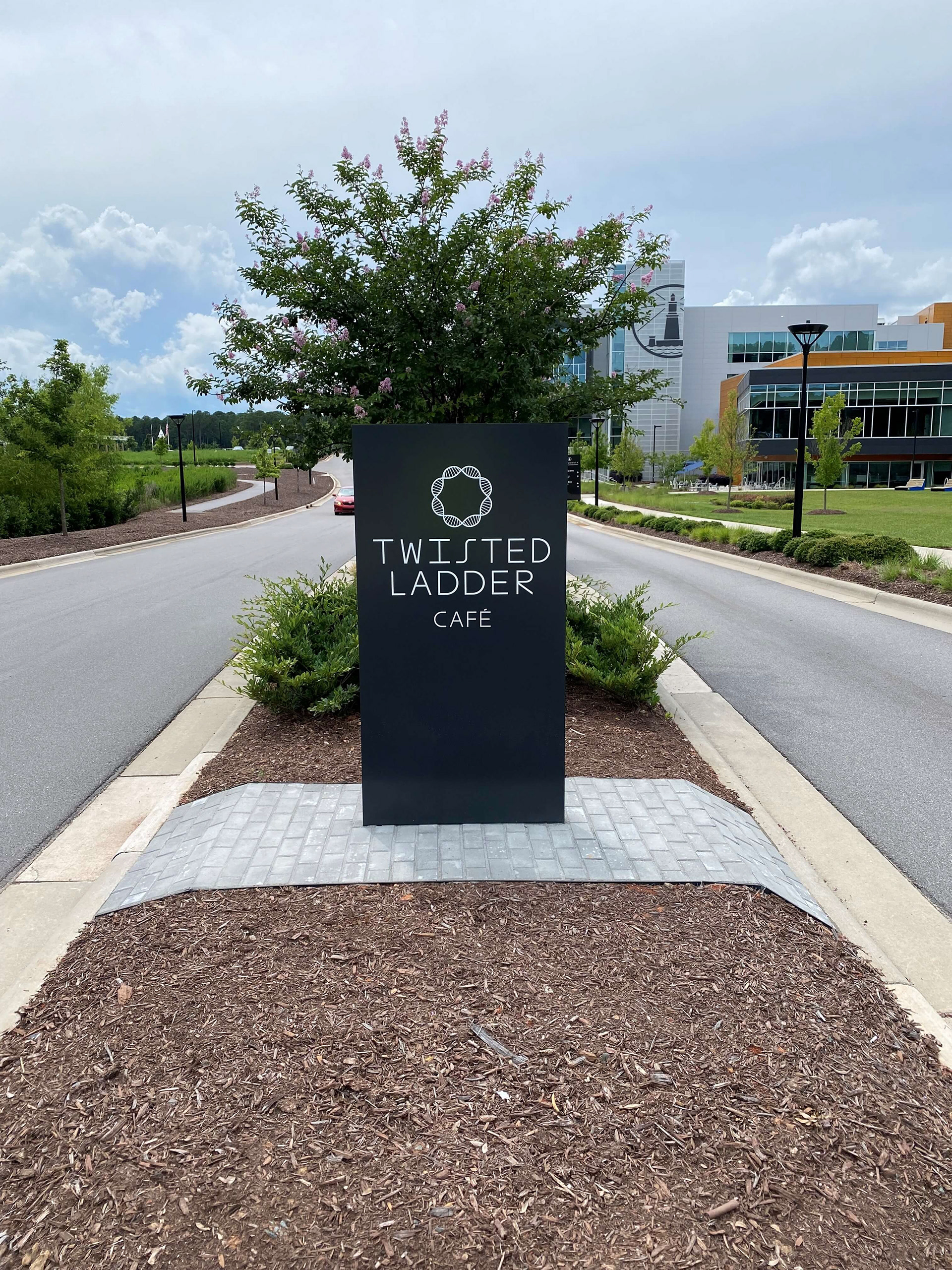 Fabricated aluminum pylon sign with applied vinyl graphics • Twisted Ladder Café, Alexandria Real Estate • Durham, NC