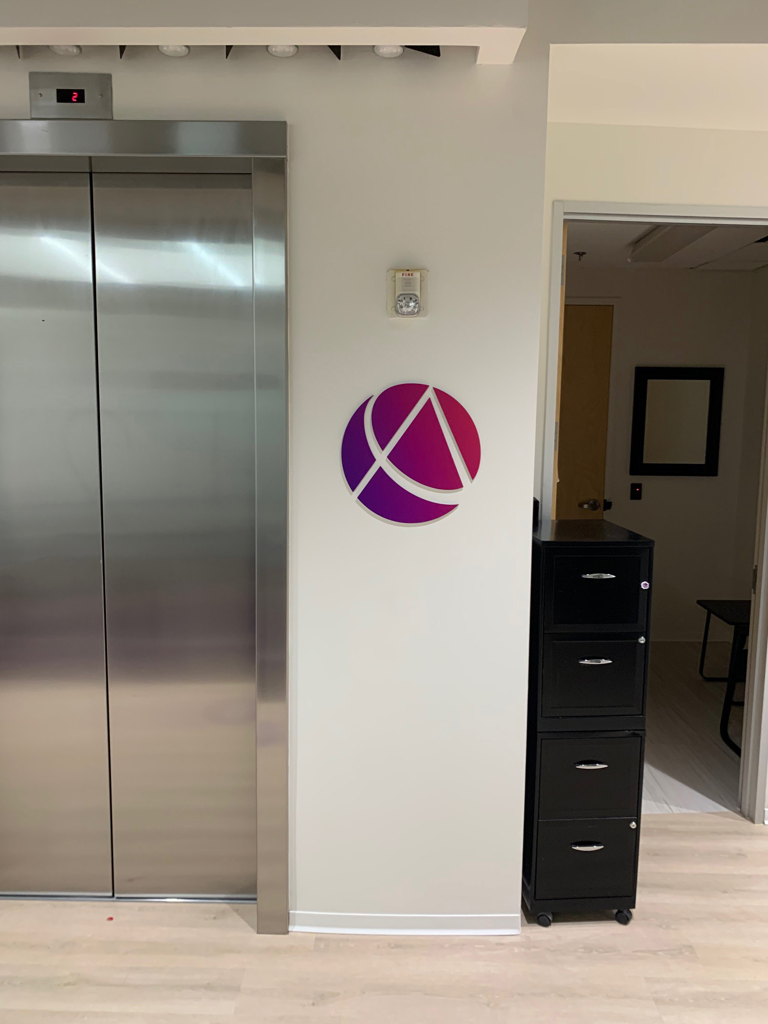 AICPA Elevator Wall Logo 2 • Cut Aluminum w/ Digital Print Gradient Overlay • Durham, NC