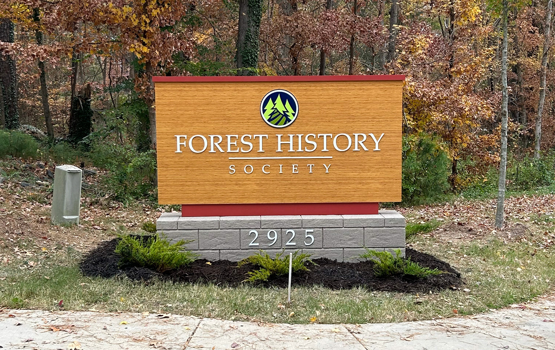 Exterior Monument • Faux Wood Paneling with Dimensional Logo & Lettering and Faux Masonry Base
