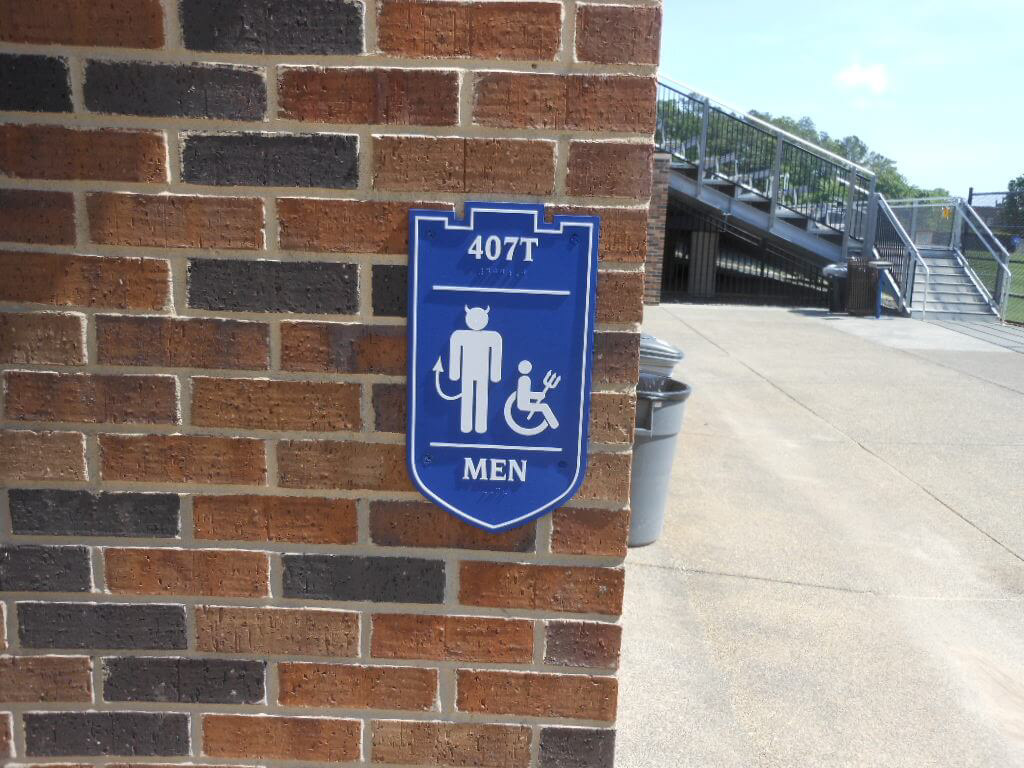Milled aluminum restroom sign, ADA-compliant • Duke University • Durham, NC