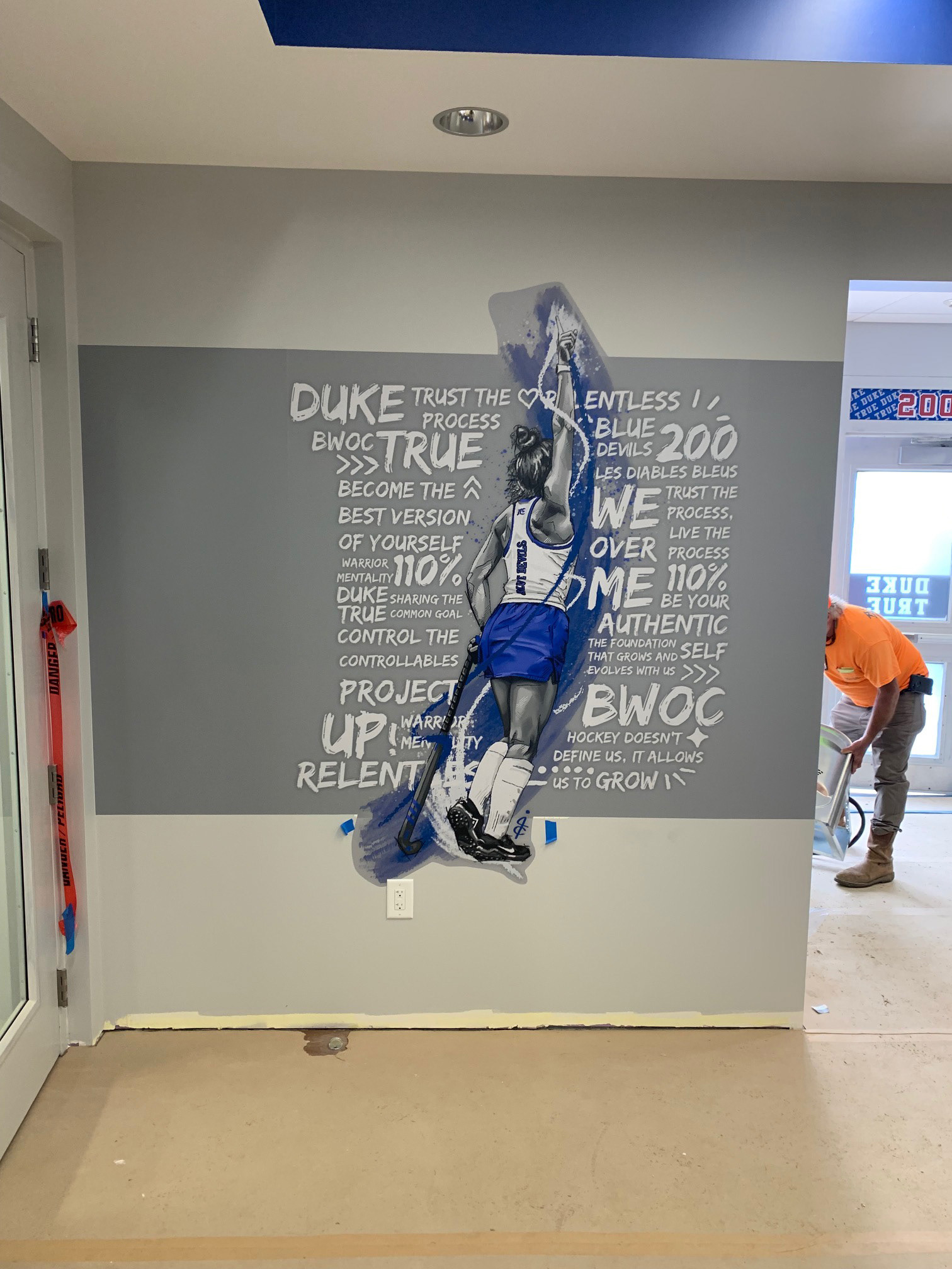 Duke Field Hockey • Team Room/Kitchen, step 1: field hockey player wall graphic (large format digital print, hand cut)