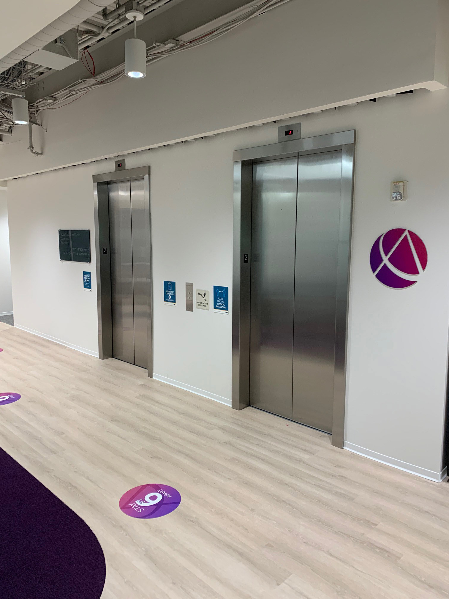 AICPA Elevator Wall Logo 2 (plus directional in distance) • Cut Aluminum w/ Digital Print Gradient Overlay • Durham, NC