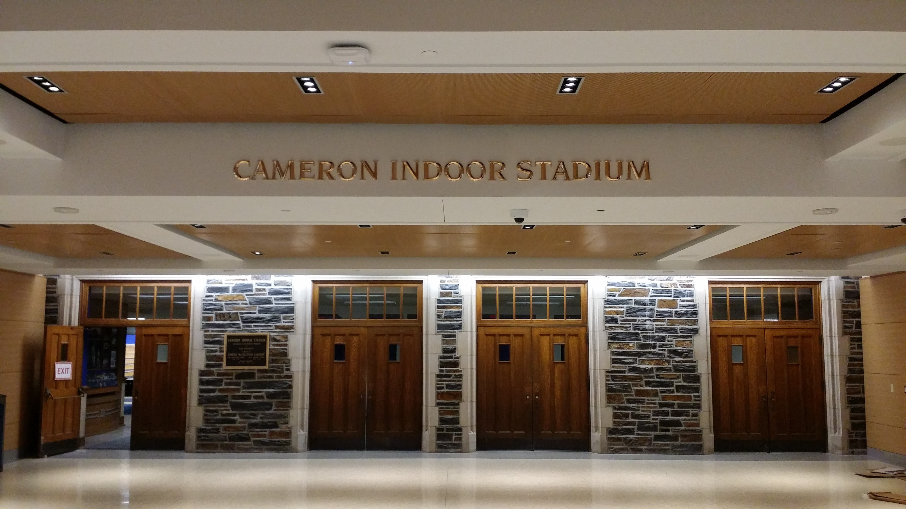 Prismatic face, cast bronze soffit letters • Cameron Indoor Stadium • Duke University