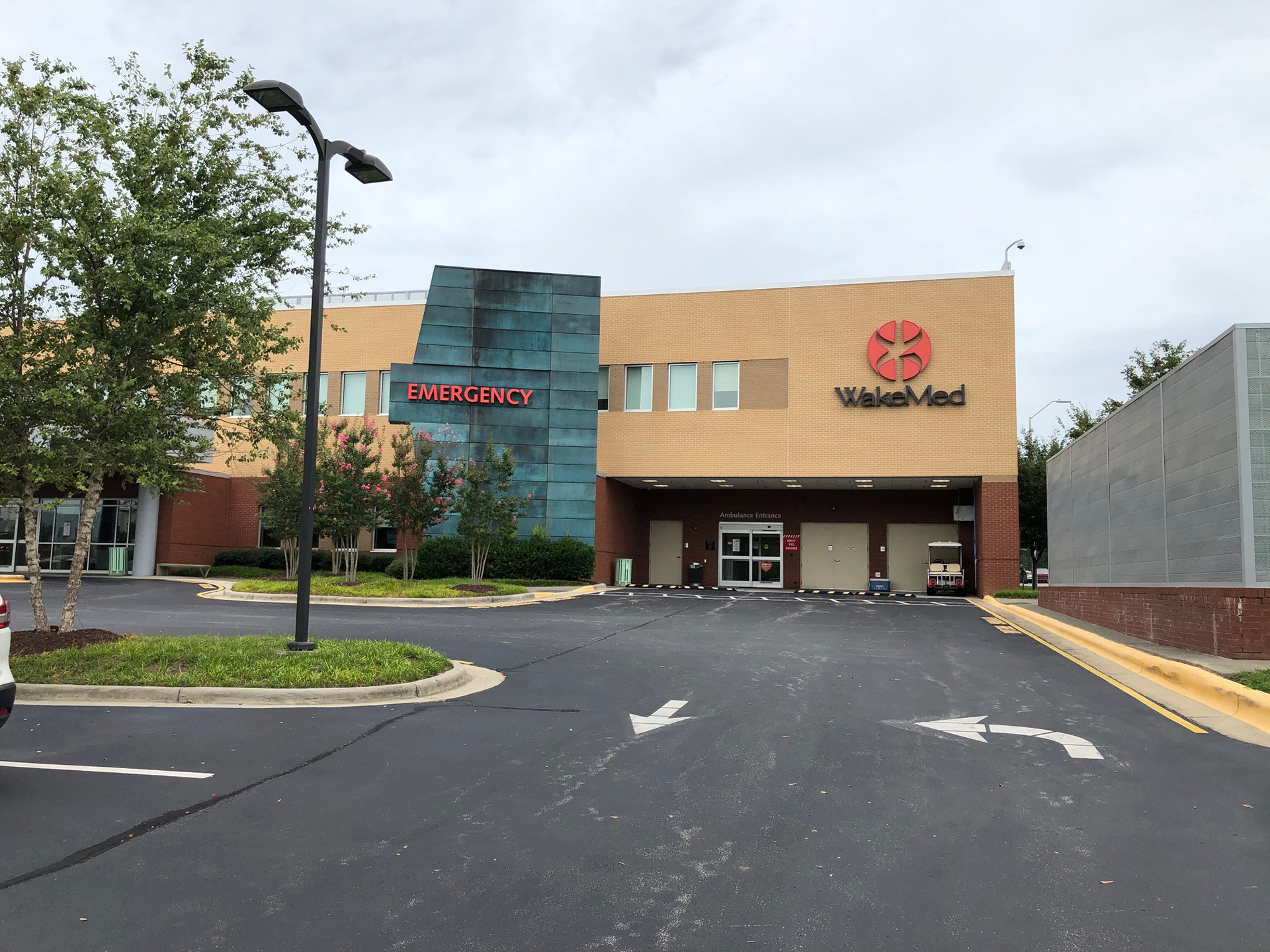 WakeMed Brier Creek Healthplex • main entrance illuminated logo and ED letters • Raleigh, NC