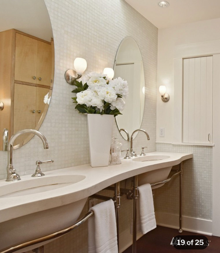 Graceful travertine and nickel finishes create quiet elegance.