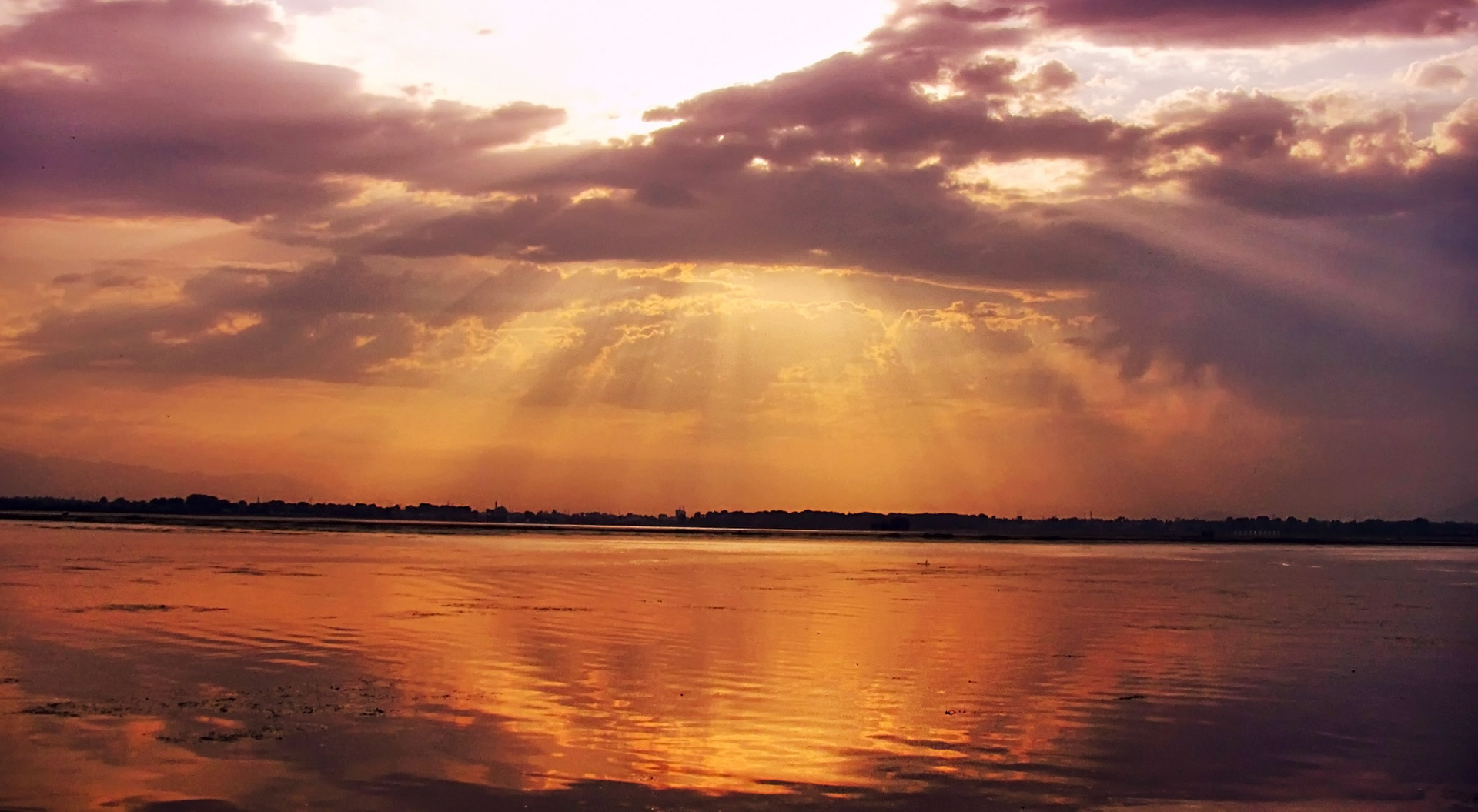 If paradise exists anywhere, it lingers here in light, cloud, and reflection | Dal Lake, Kashmir