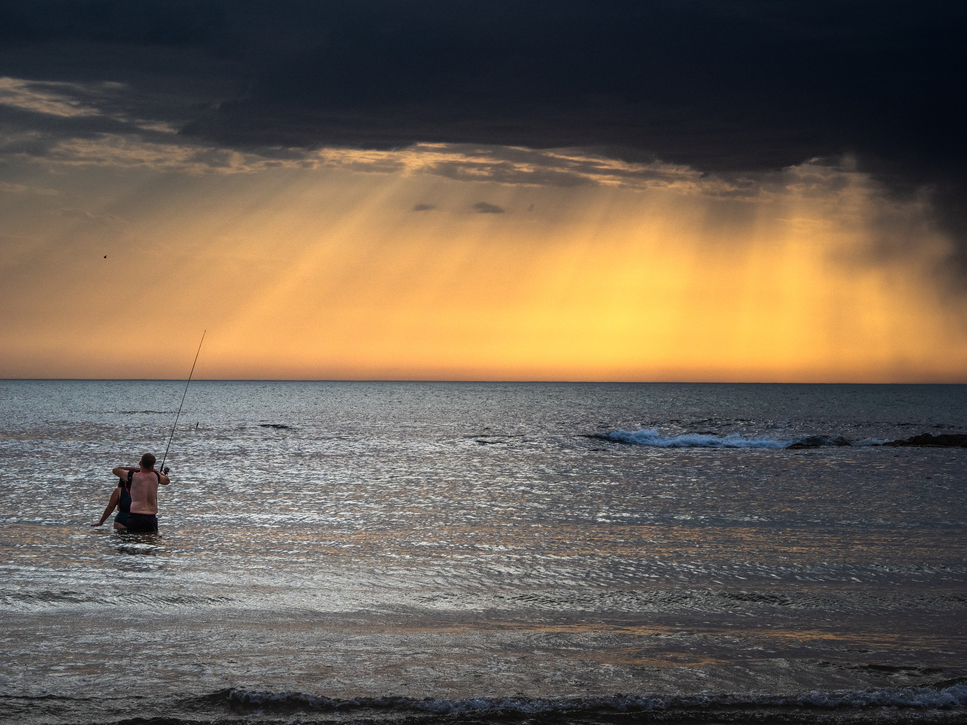 pêche sous un rayons de soleil