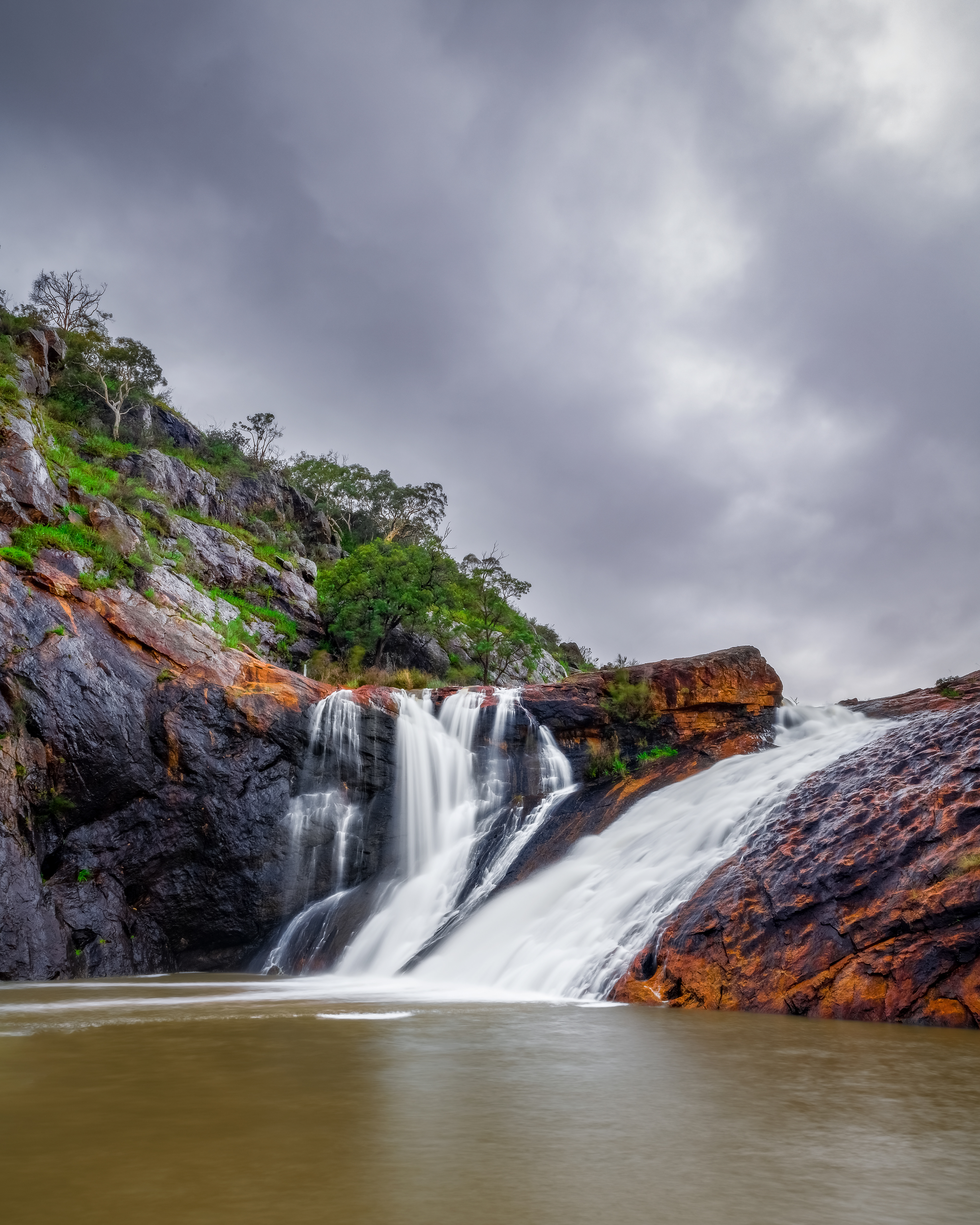 Serpentine Falls in full flow, as seen from the main viewing area by the base of the waterfall.