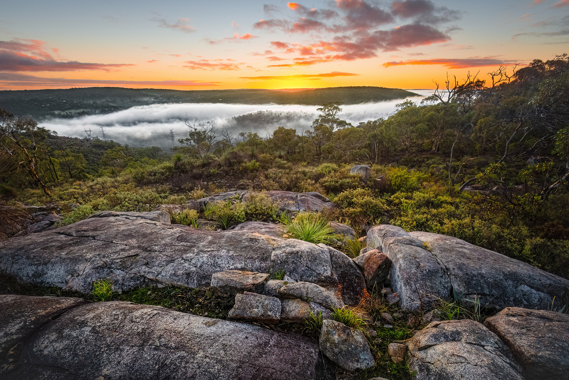 A "river" of fog flows through a valley in the Perth Hills, WA