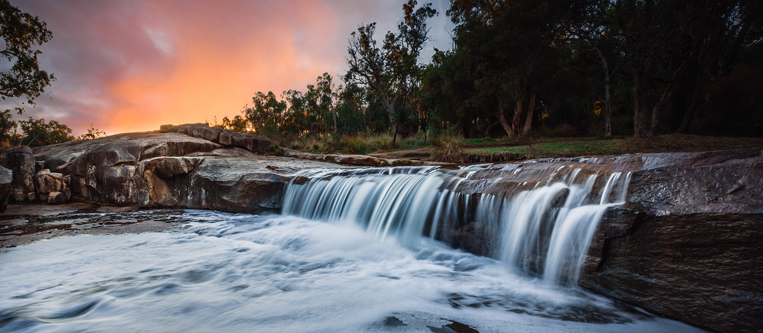Noble Falls under a colourful sunset.
