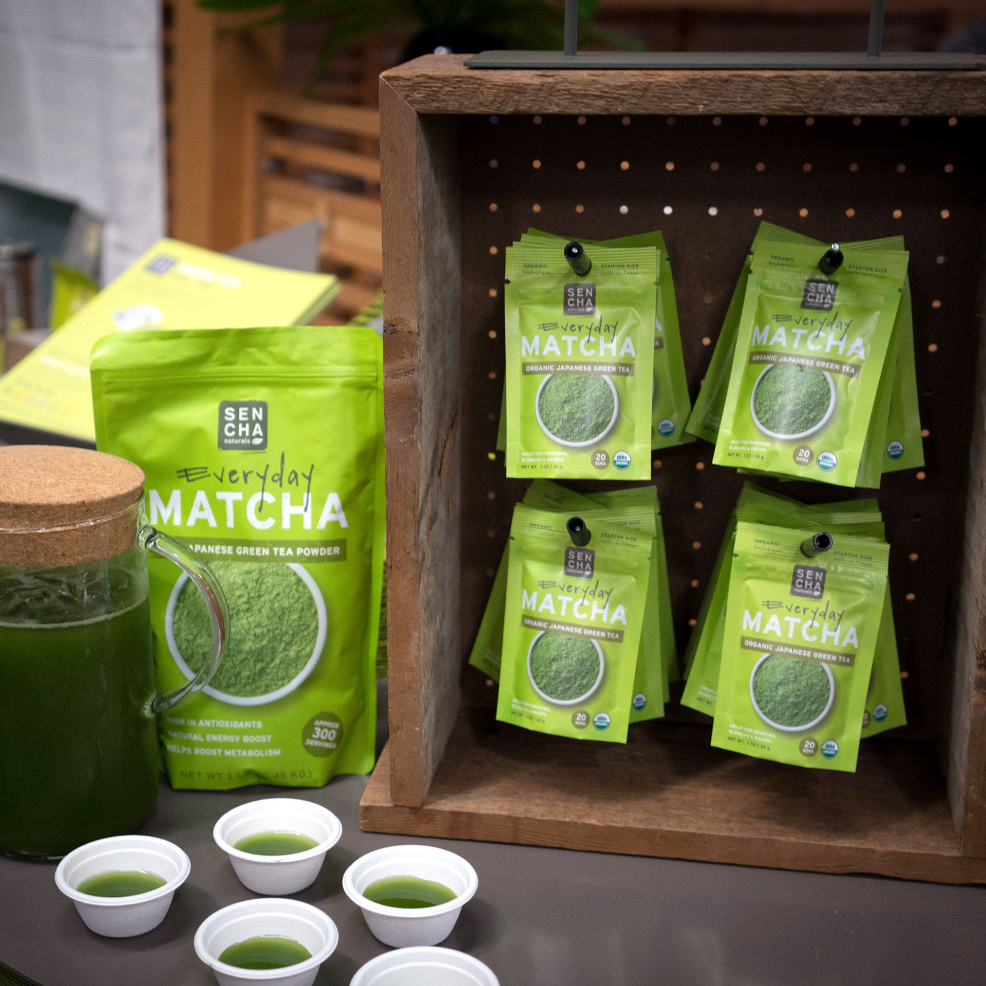 Wooden pegboard display along with matcha sampling station.