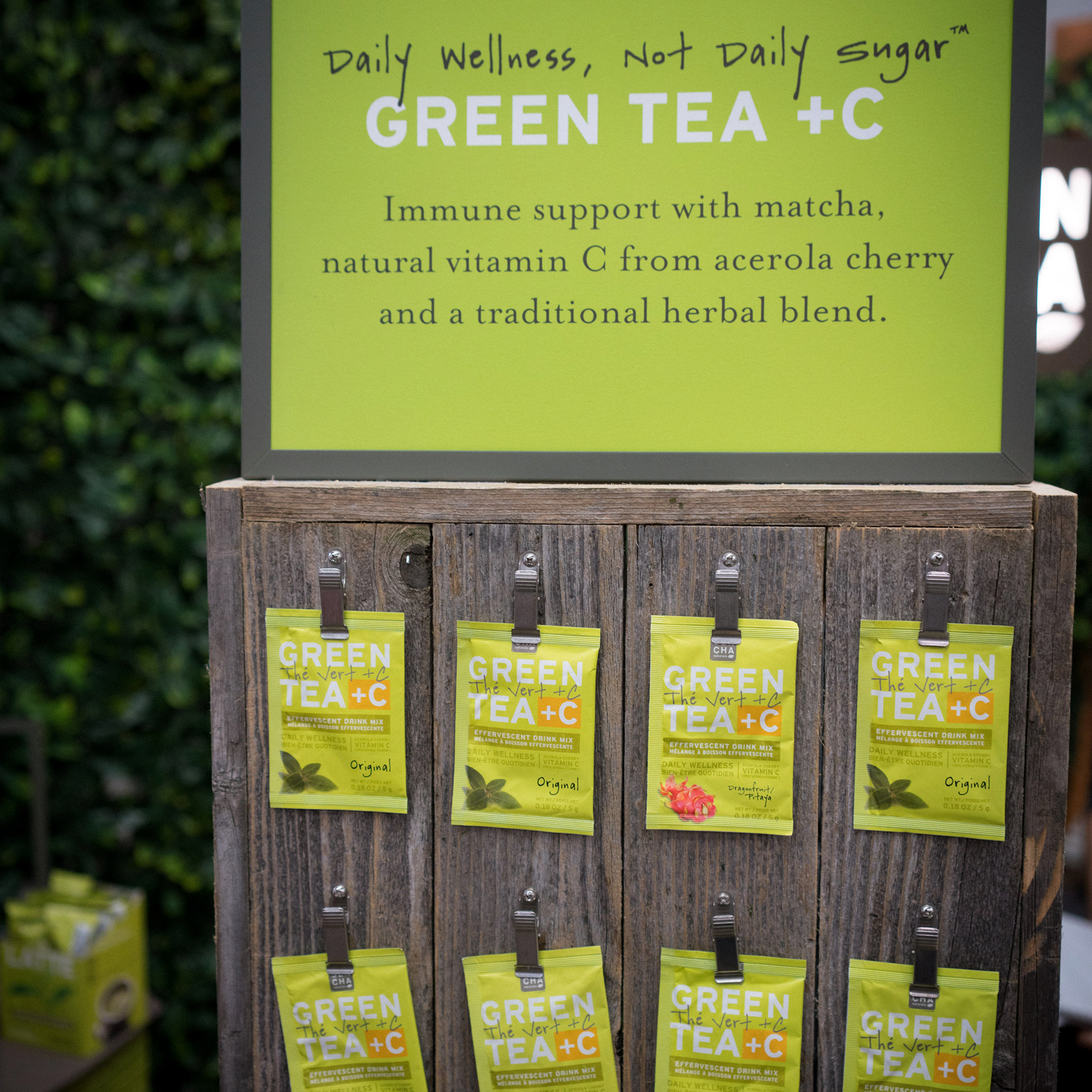 Green Tea +C packet display stand with top signage.