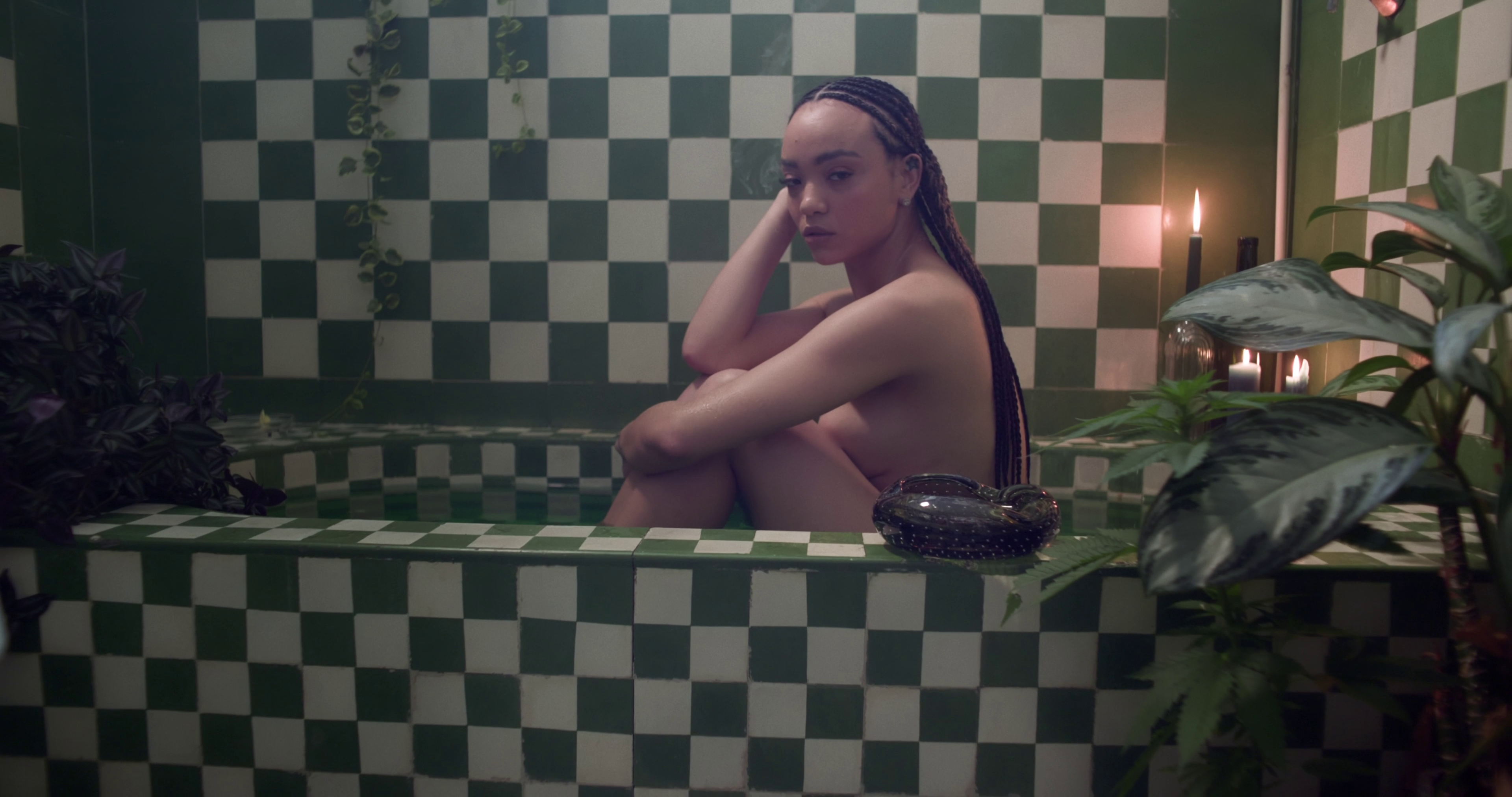 Still 02: Terrasha in a medium shot in the same bathtub.