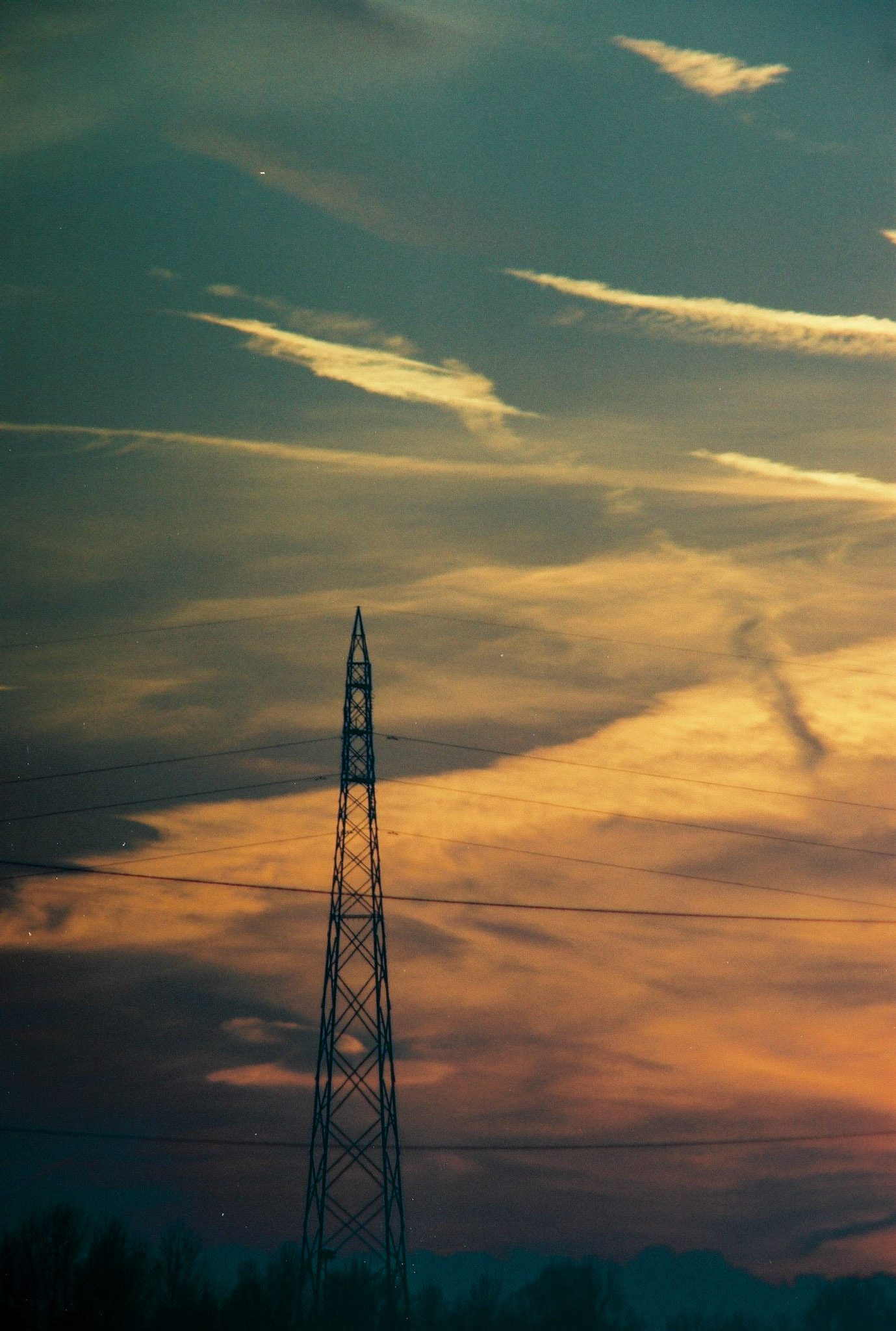 An electrical pylon in a beautiful sunset.