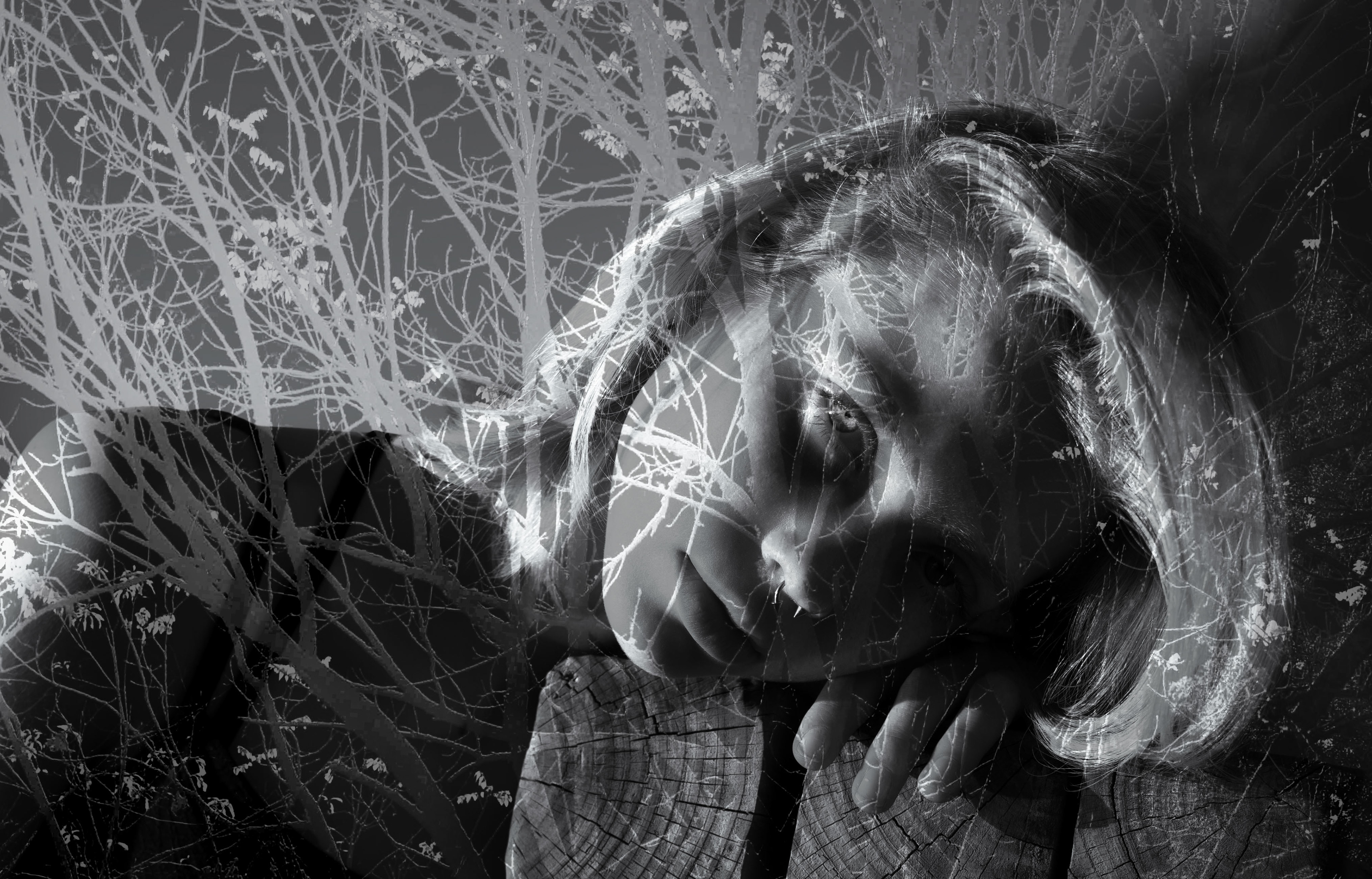 portrait of a lady behind a tree image