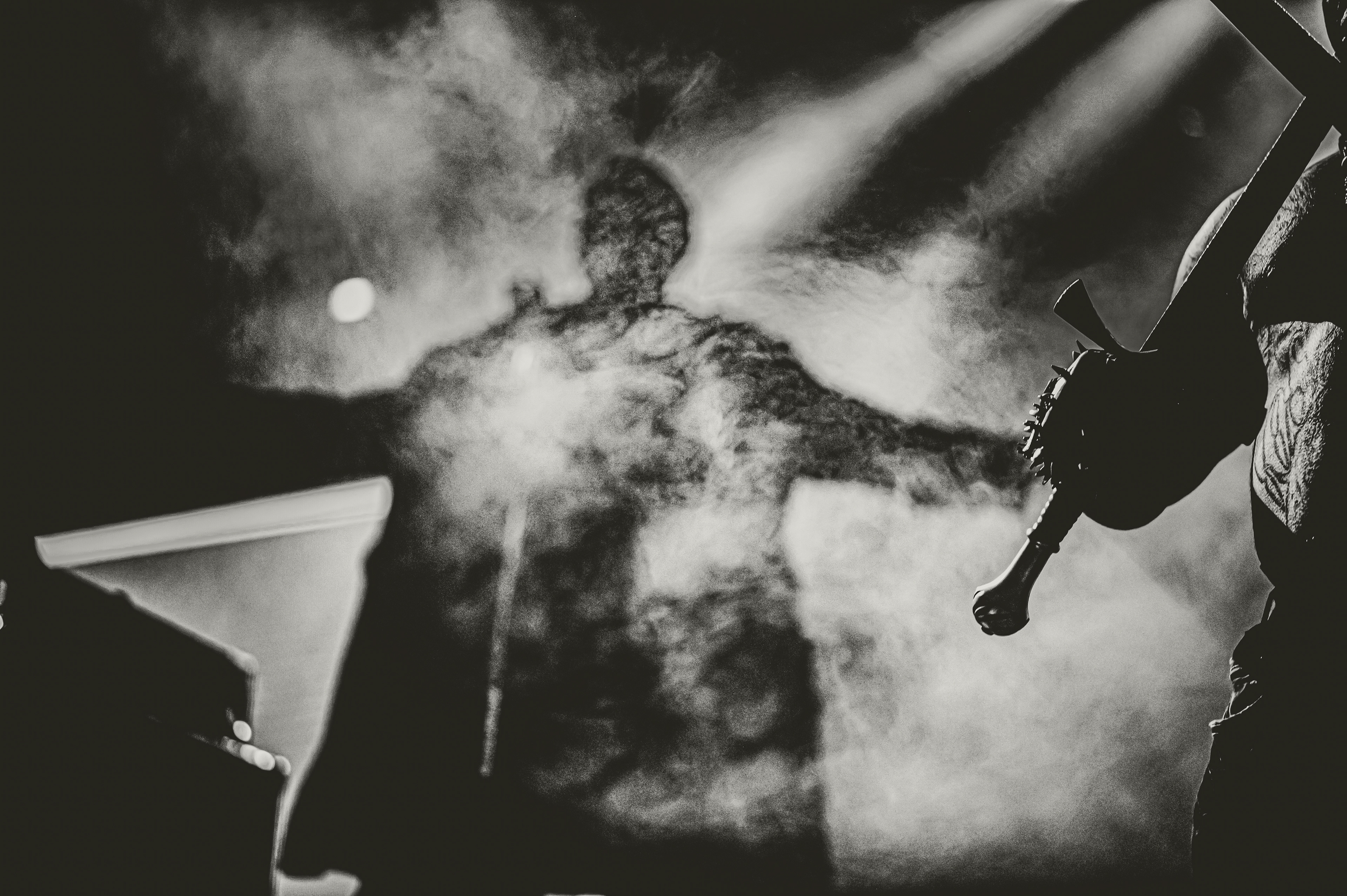 Musician at the concert behind the smoke