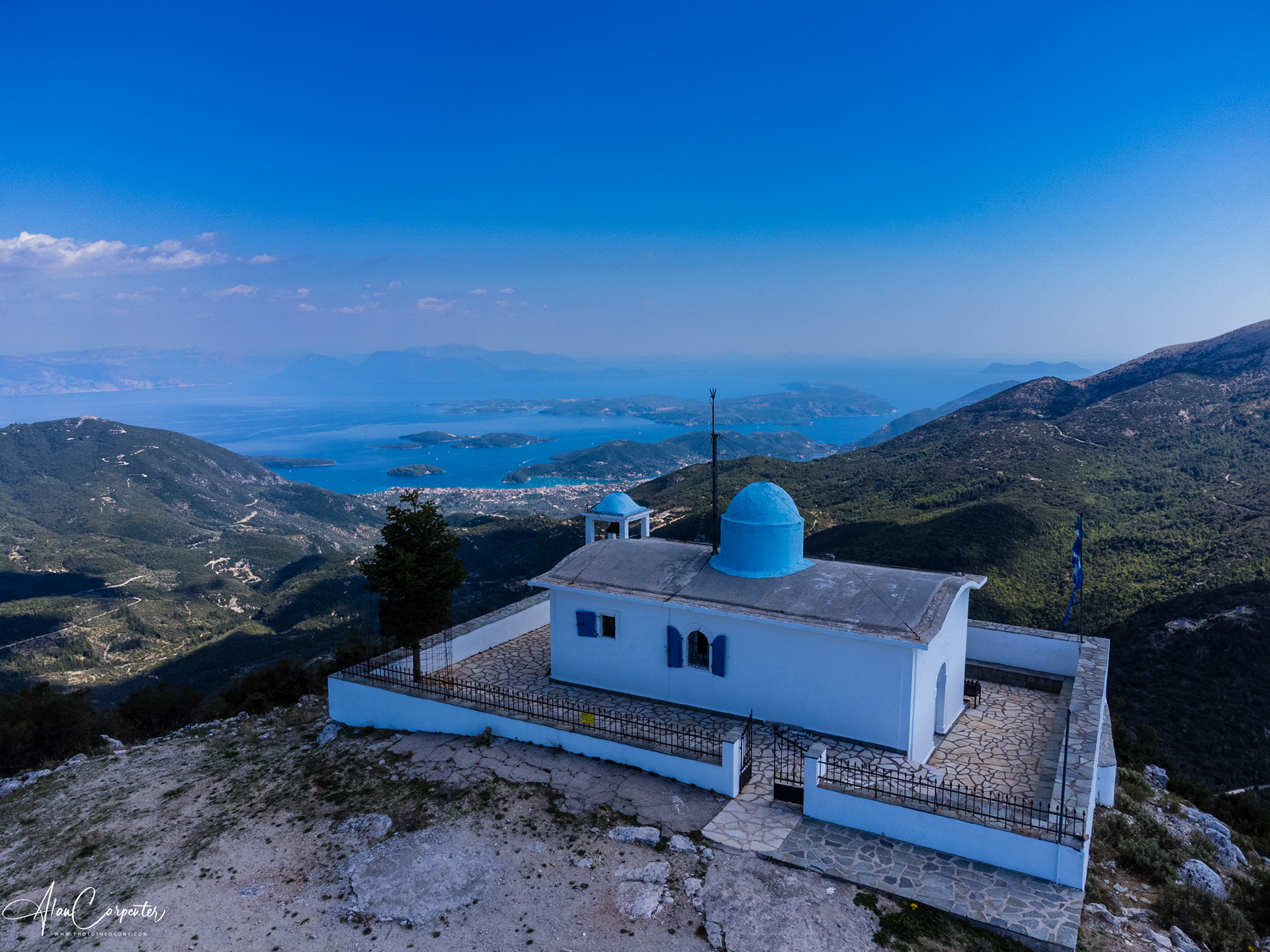 Take the drive up into the island’s mountains — the tiny church of Profitis Ilias sits high above the clouds with views that make every hairpin bend worth it