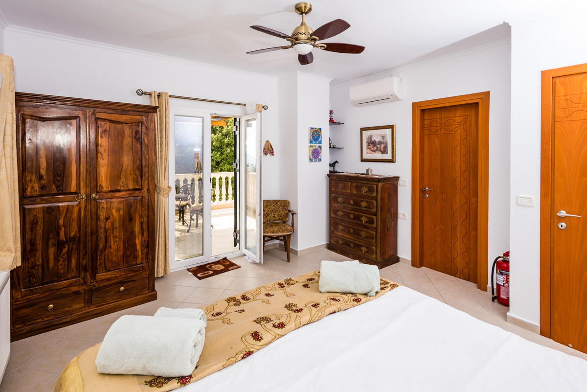 Bright and airy master bedroom with doors to the private sea-view terrace
