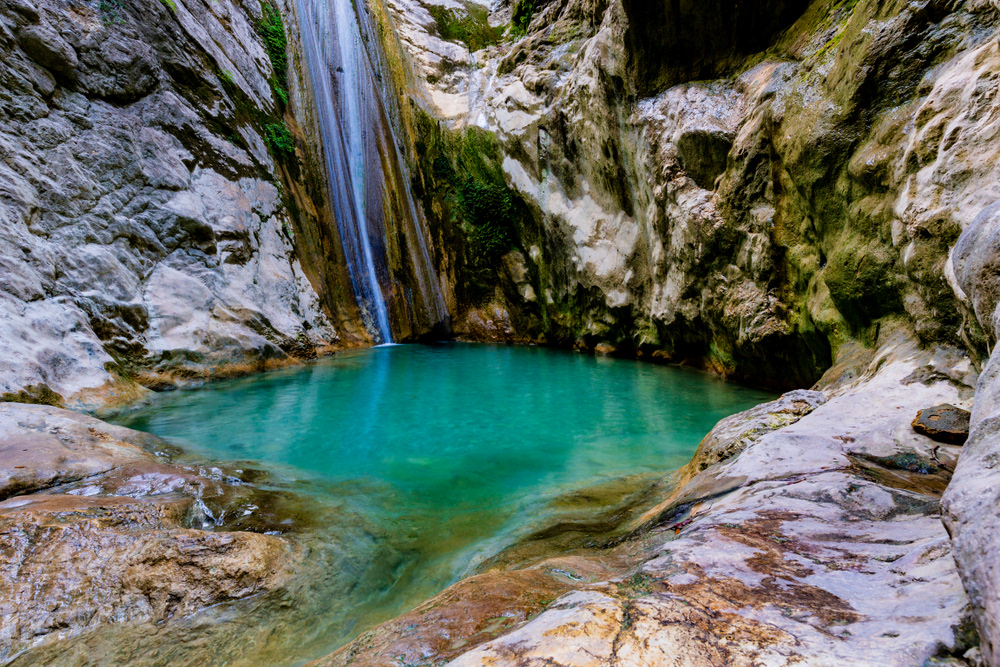 Tucked away at the base of the hills above Nidri, these waterfalls are a favourite family walk — shady paths, cool pools, and the reward of a dip under the falls
