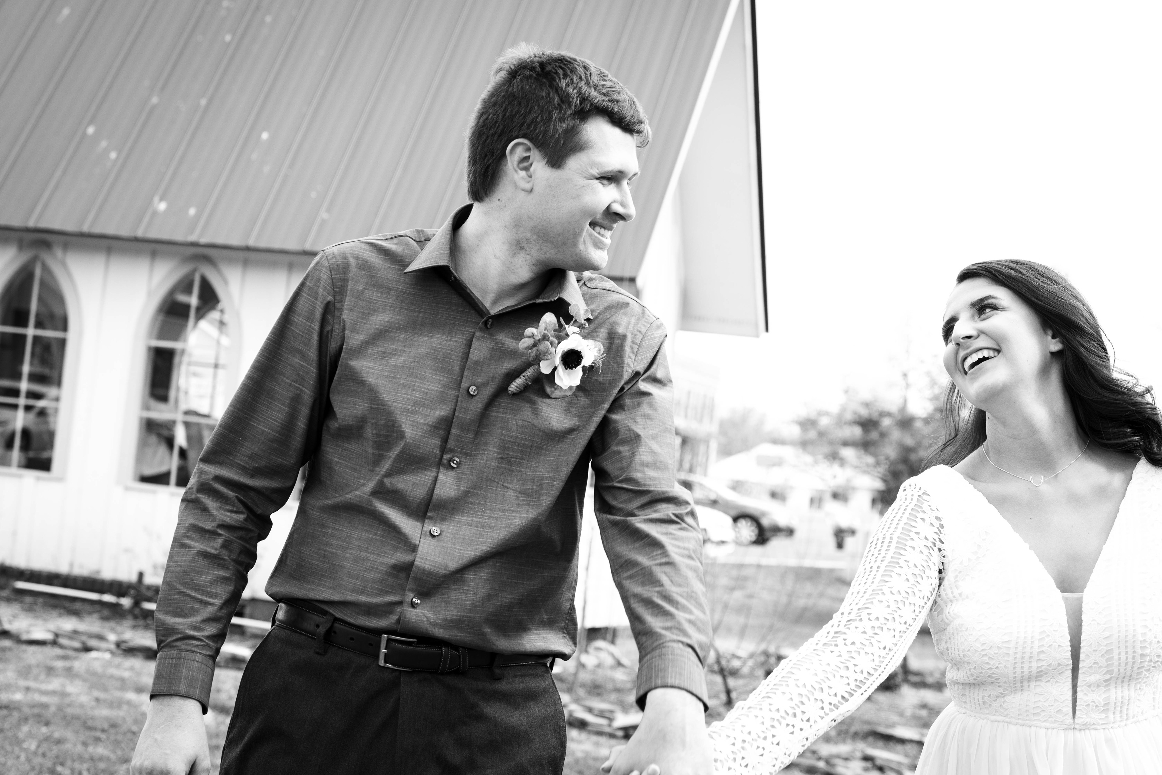 Husband and wife skip away from chapel