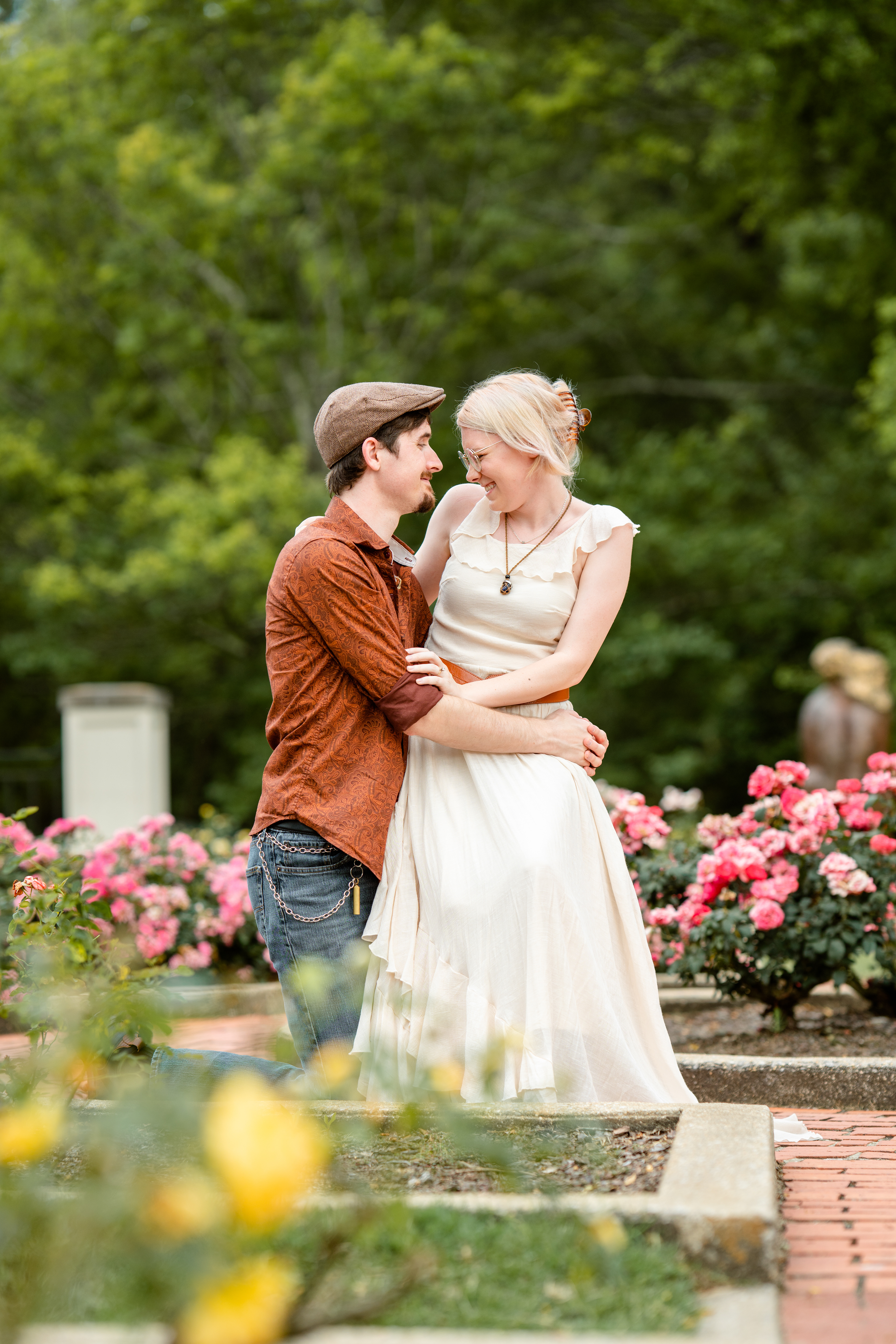 Engaged couple among the roses at the Botanical Gardens in Birmingham, AL