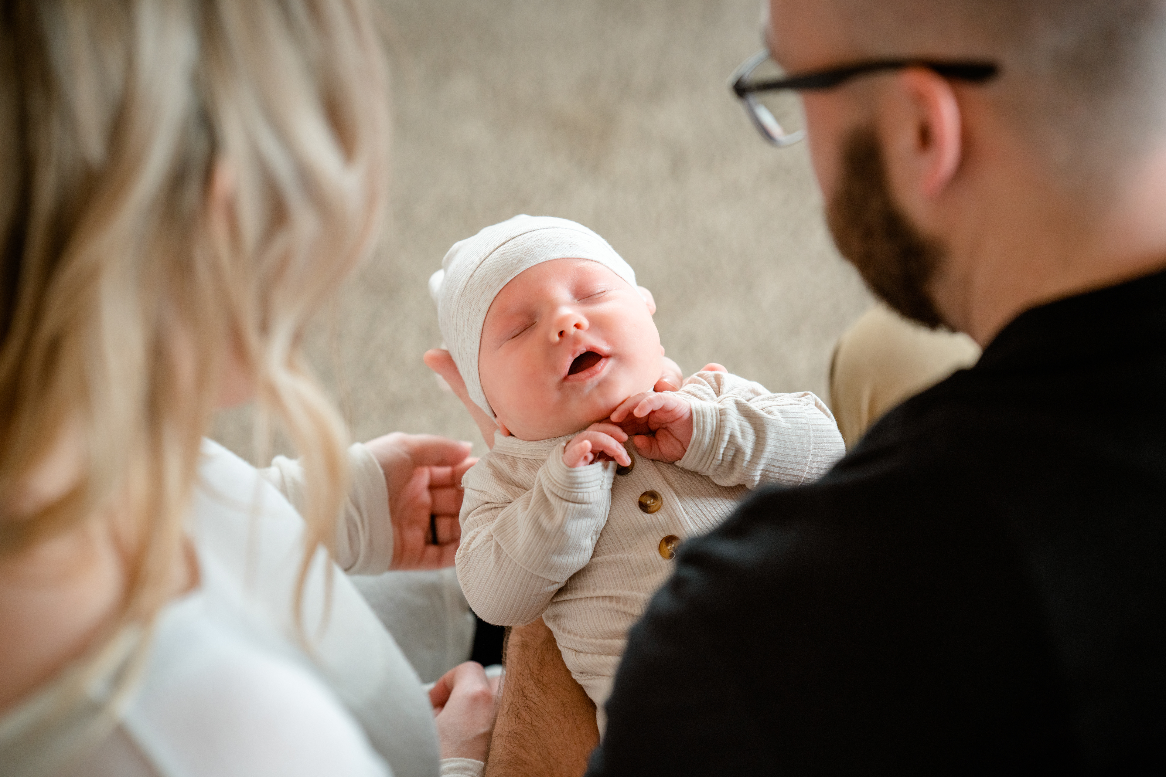 Mom and Dad tend to their newest son