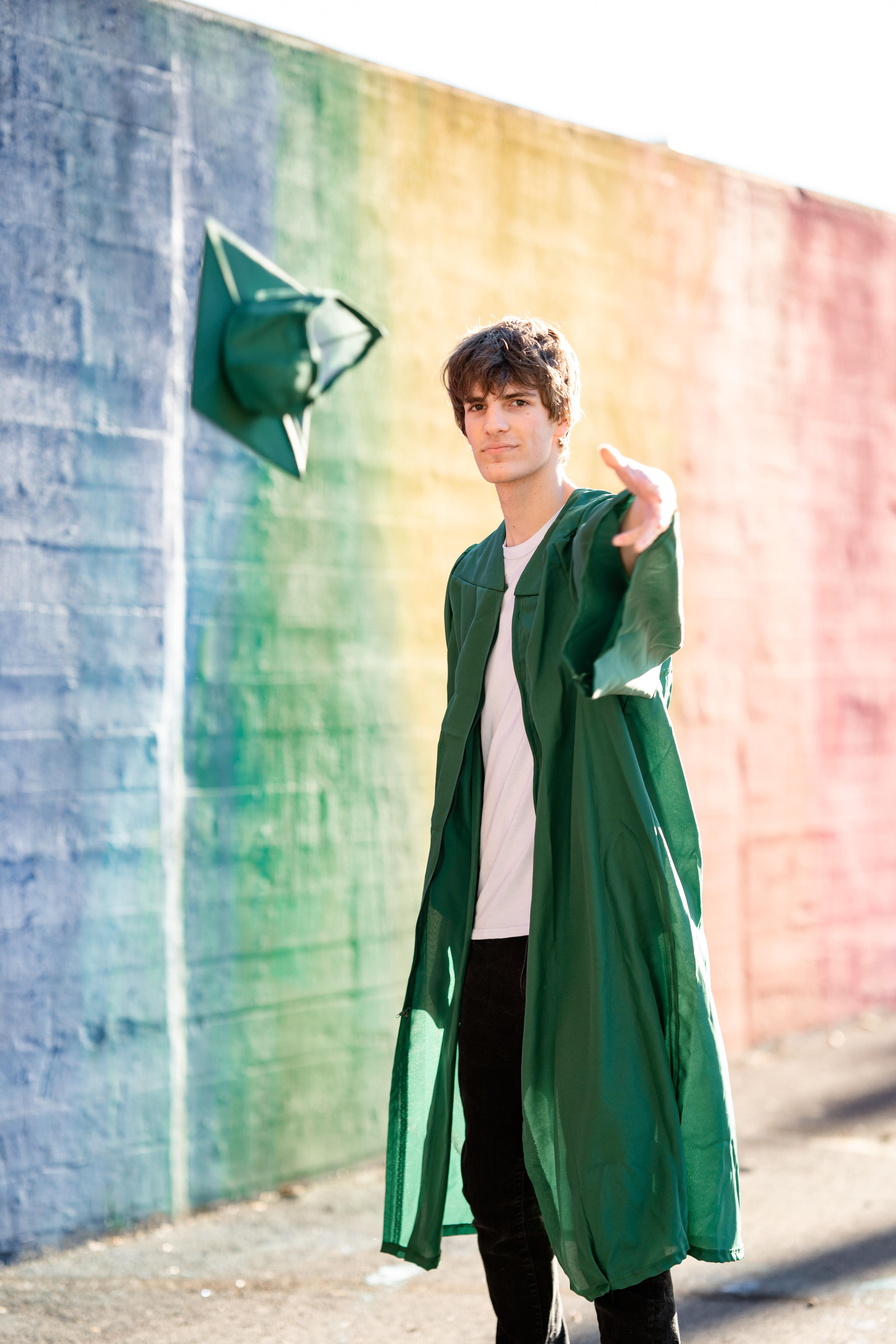 Senior boy throws graduation cap