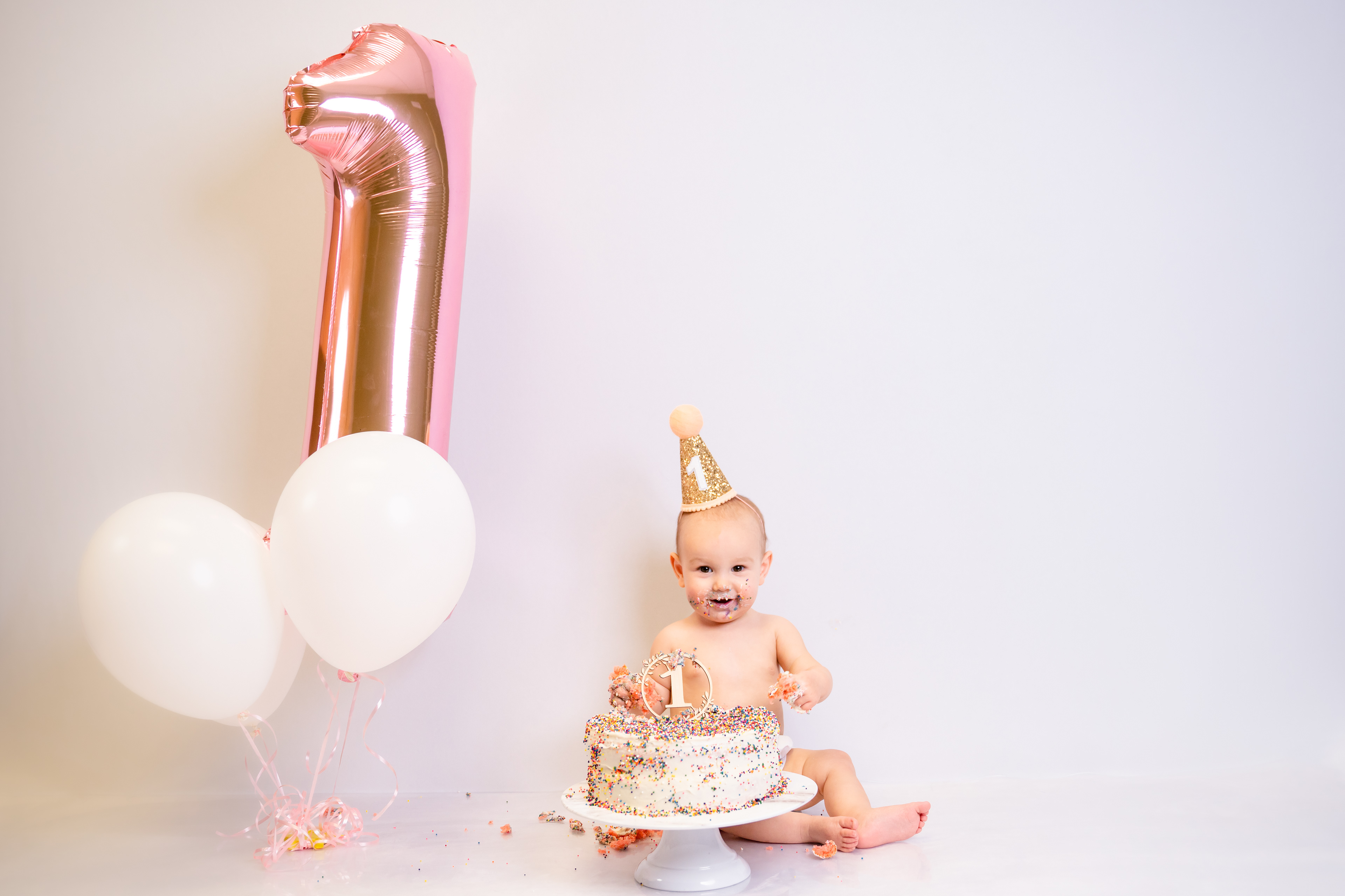Classic plain white smash cake session in studio