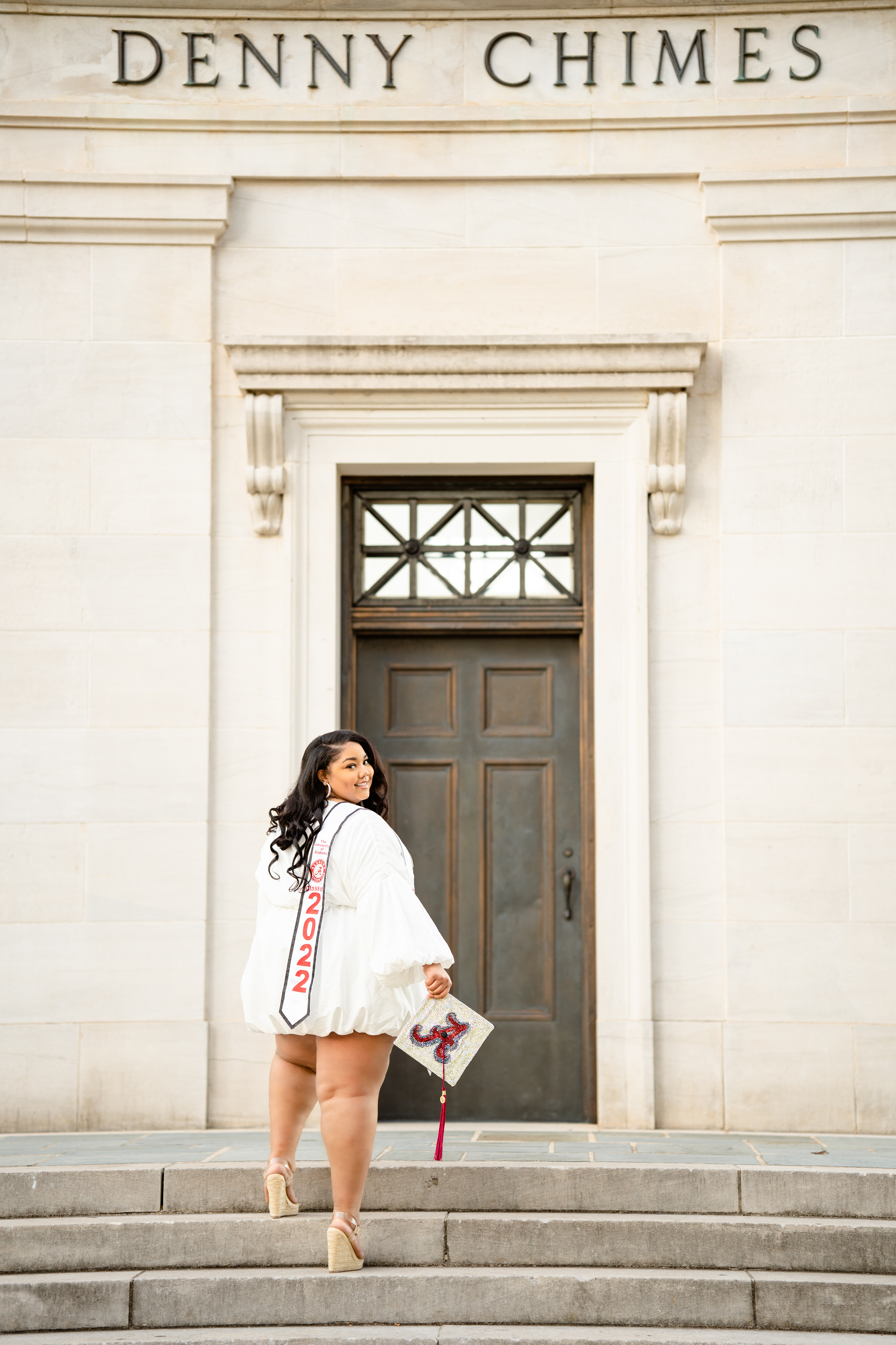 Graduate climbs stairs to the Denny Chimes on campus at the University of Alabama