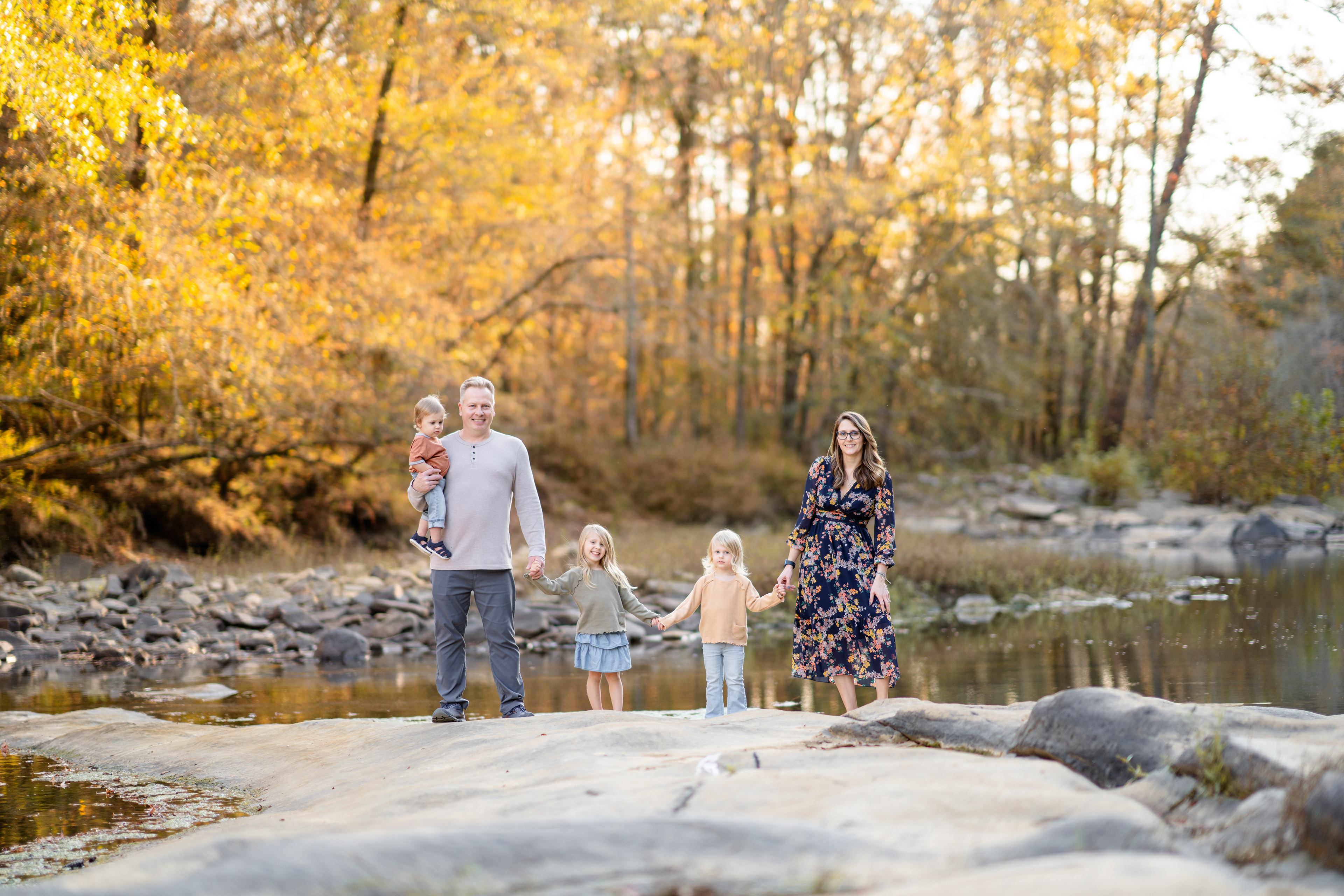 Fall family photo near water