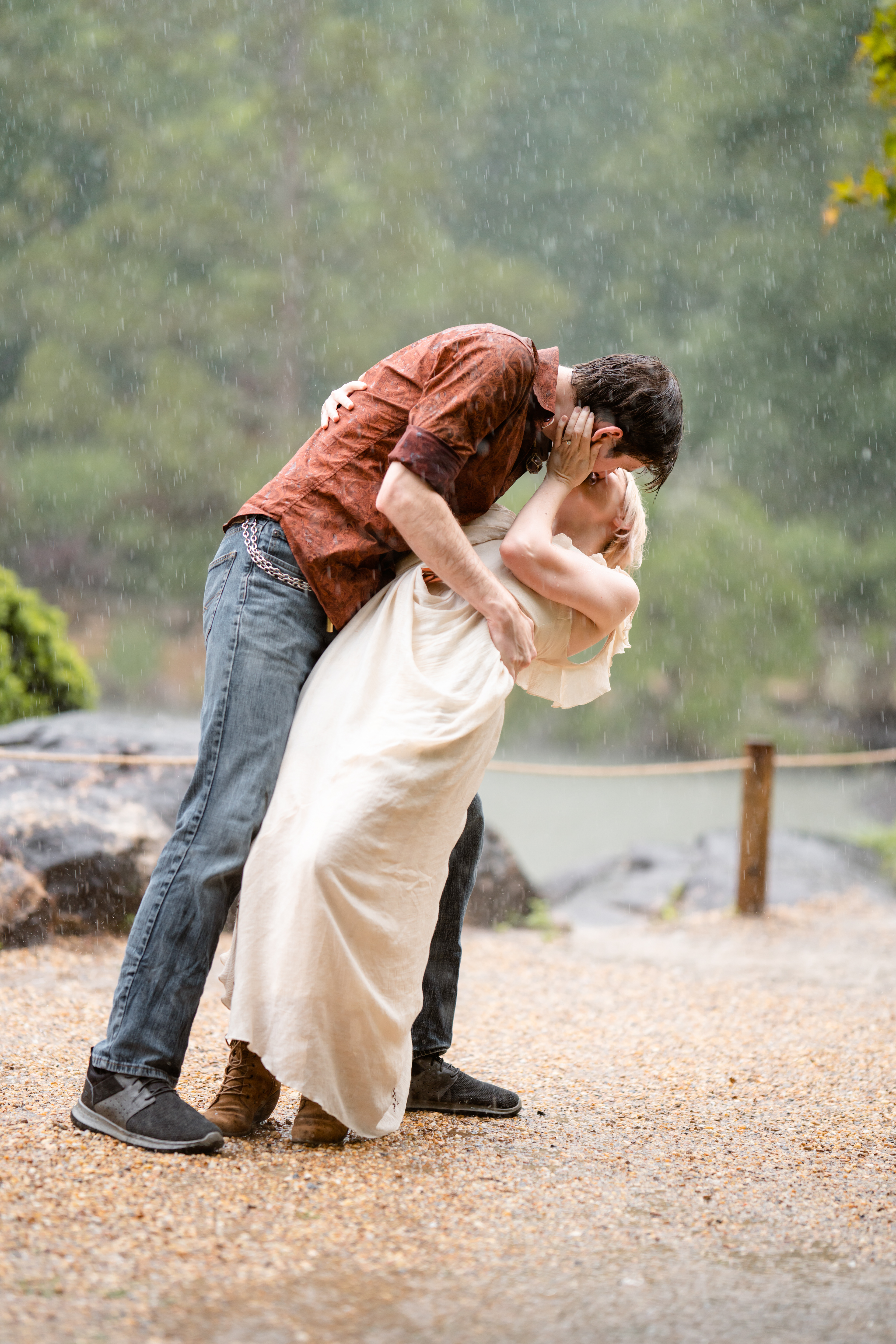 Man dips his fiancé in the rain
