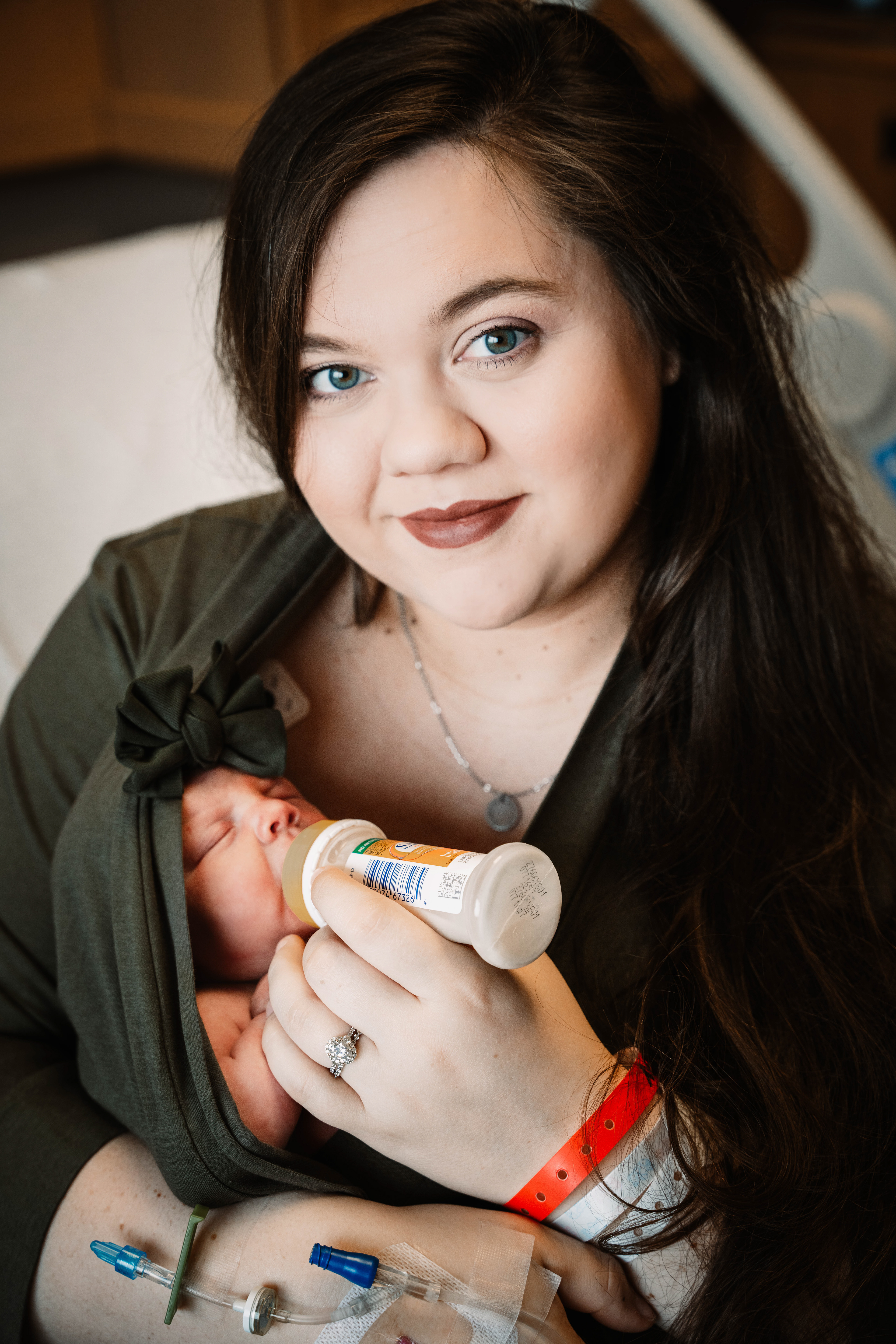 New mom bottle feeds her newborn baby