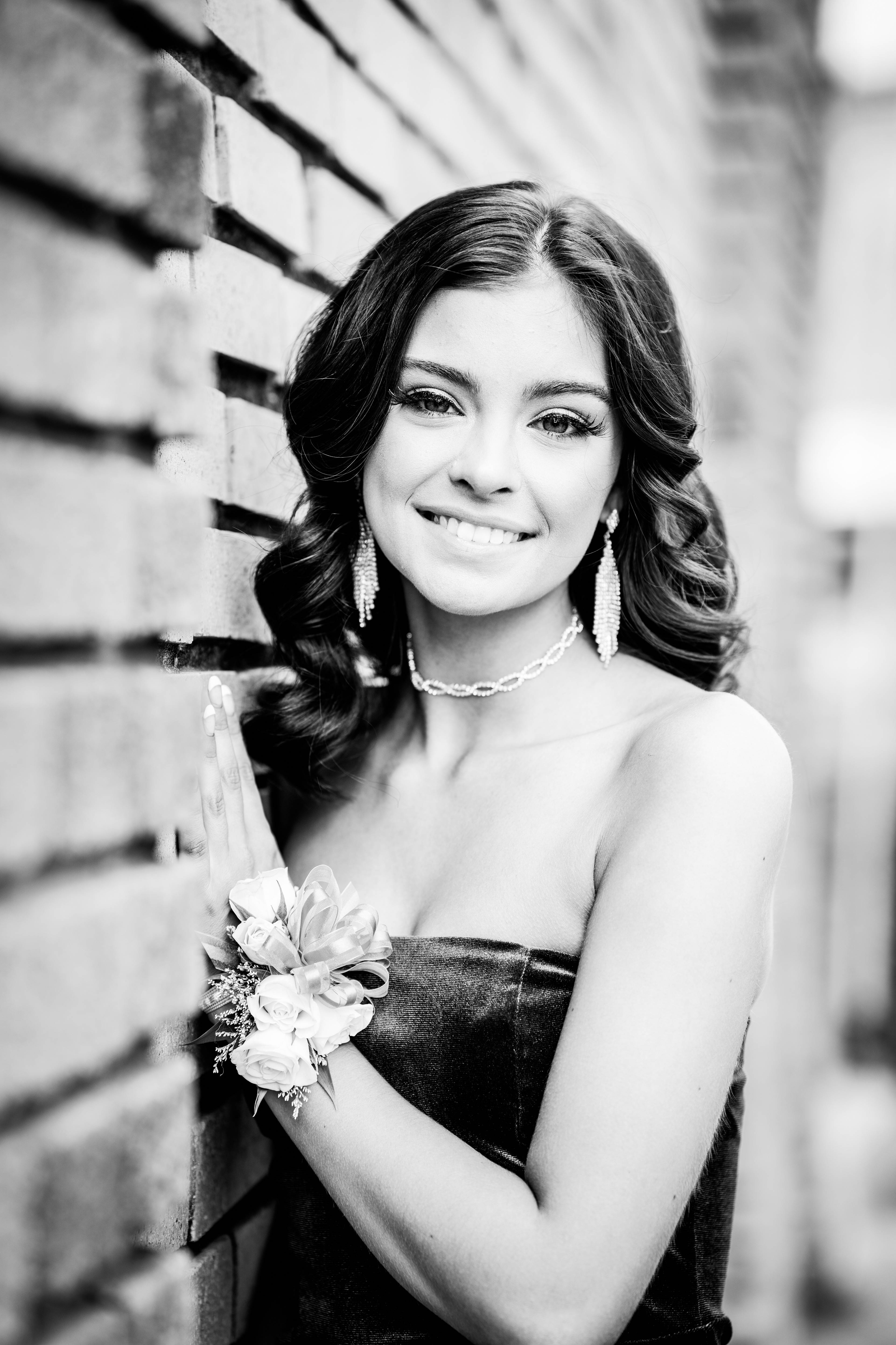 Black and white prom photo of girl senior