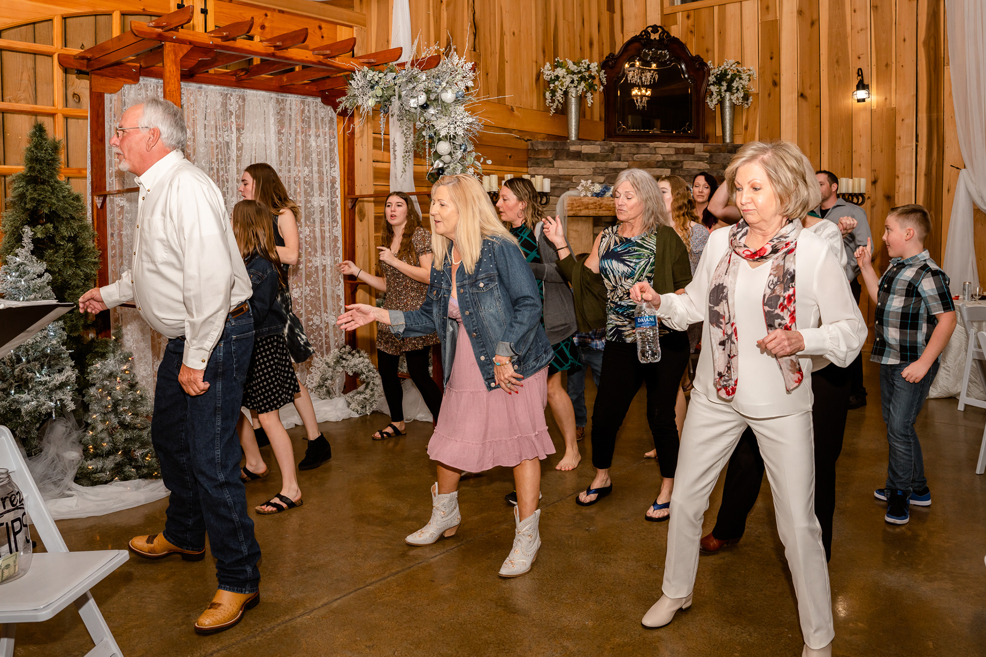 Guests do the electric slide at wedding reception