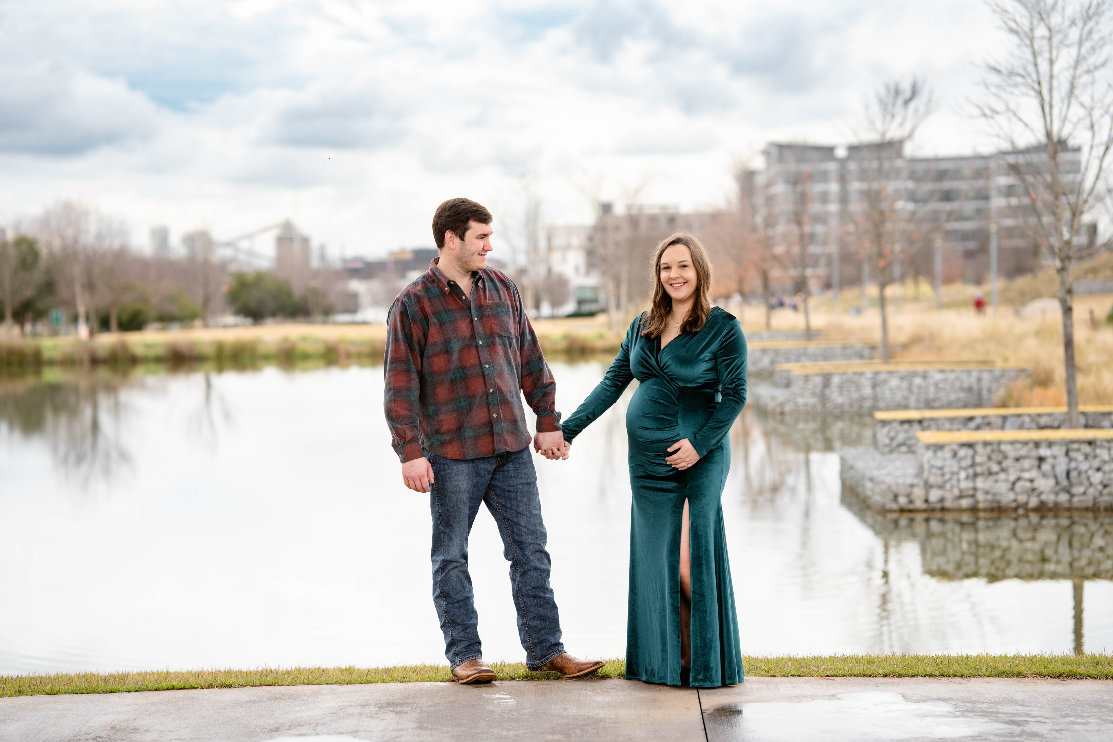 Husband looks admiringly at his pregnant wife