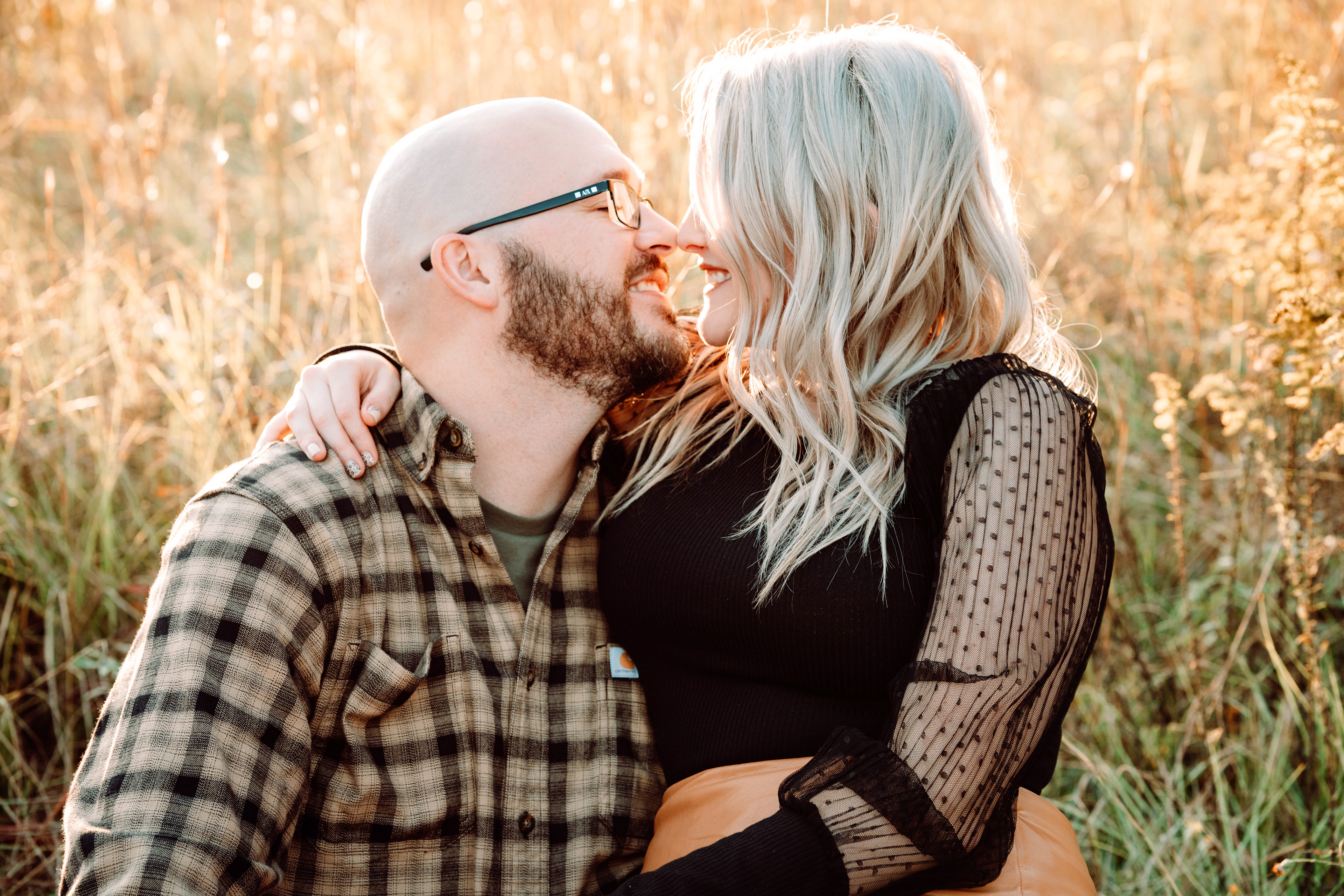 Husband and wife in a hay field