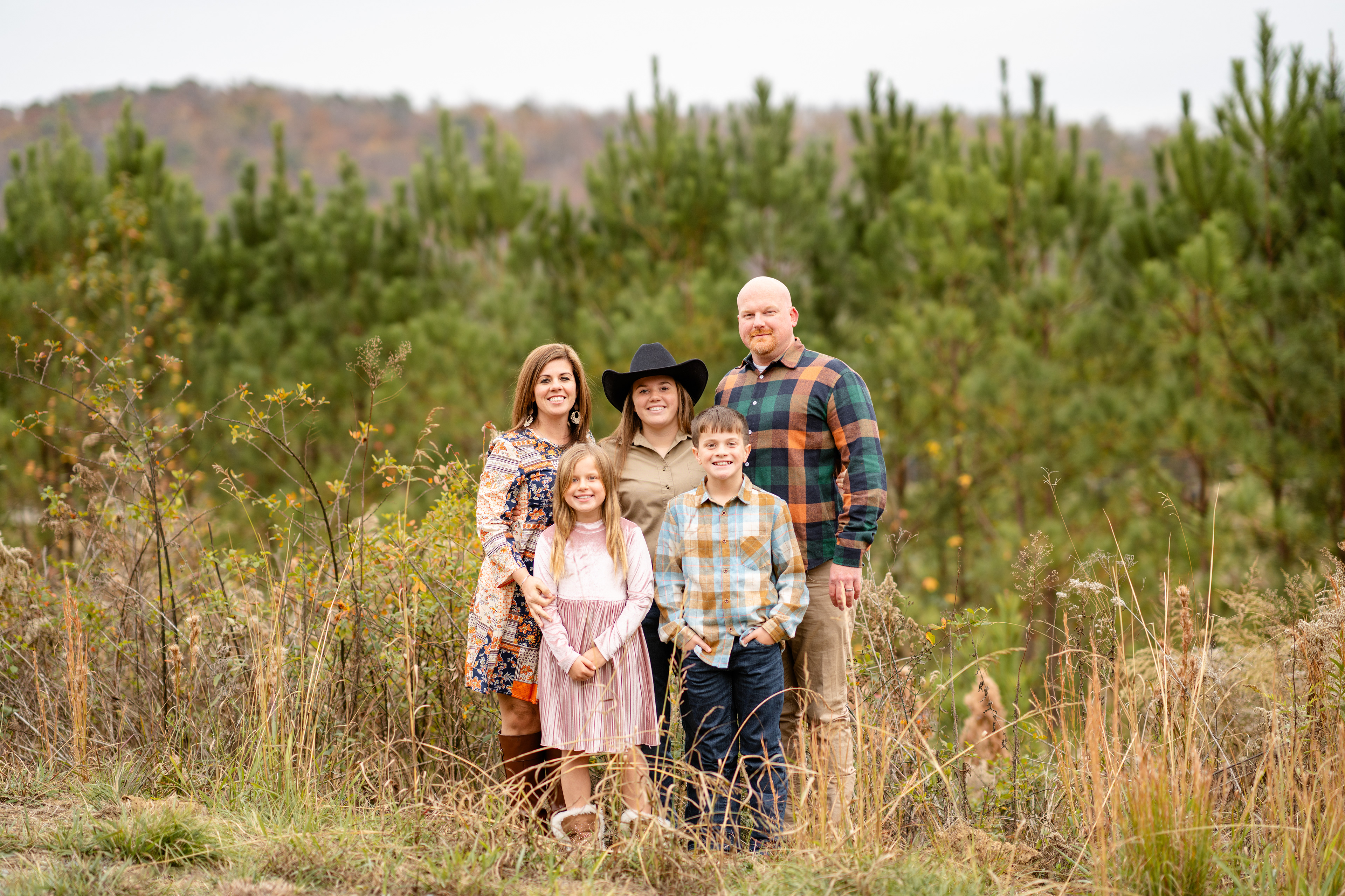 Fall family photo with colorful view in background